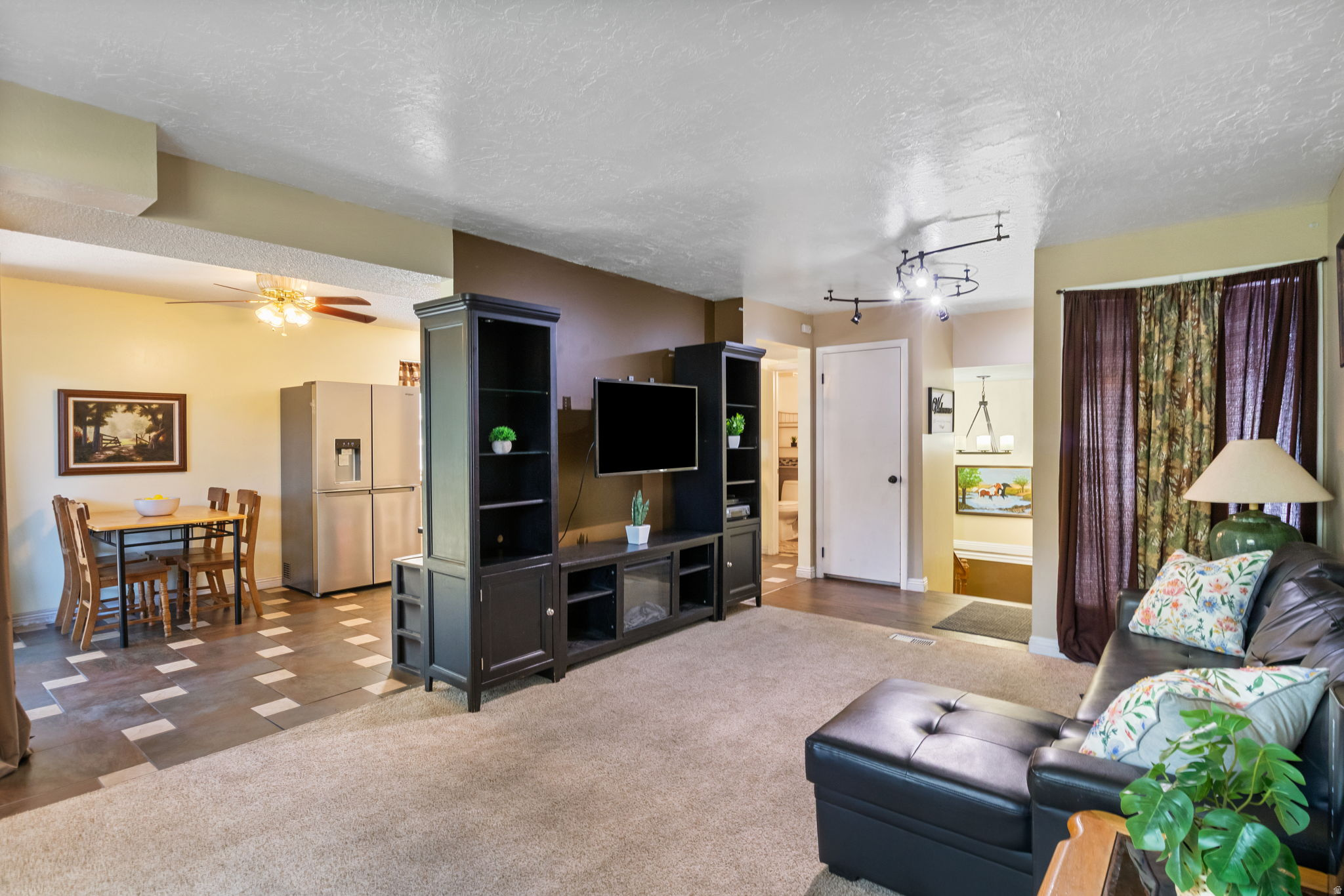 If you've been looking for a home with character and outdoor space, this one is worth a look. Enjoy beautiful mountain views from the wrap-around deck, surrounded by mature trees that create a peaceful, established setting. Conveniently located near Weber State University and Ogden-Weber Technical College, you'll also appreciate the covered carport with additional storage space for all your extras. It's a place where you can relax, entertain, and enjoy the best of both convenience and scenery.  Square footage figures are provided as a courtesy estimate only and were obtained from county record. Buyer is advised to obtain an independent measurement.