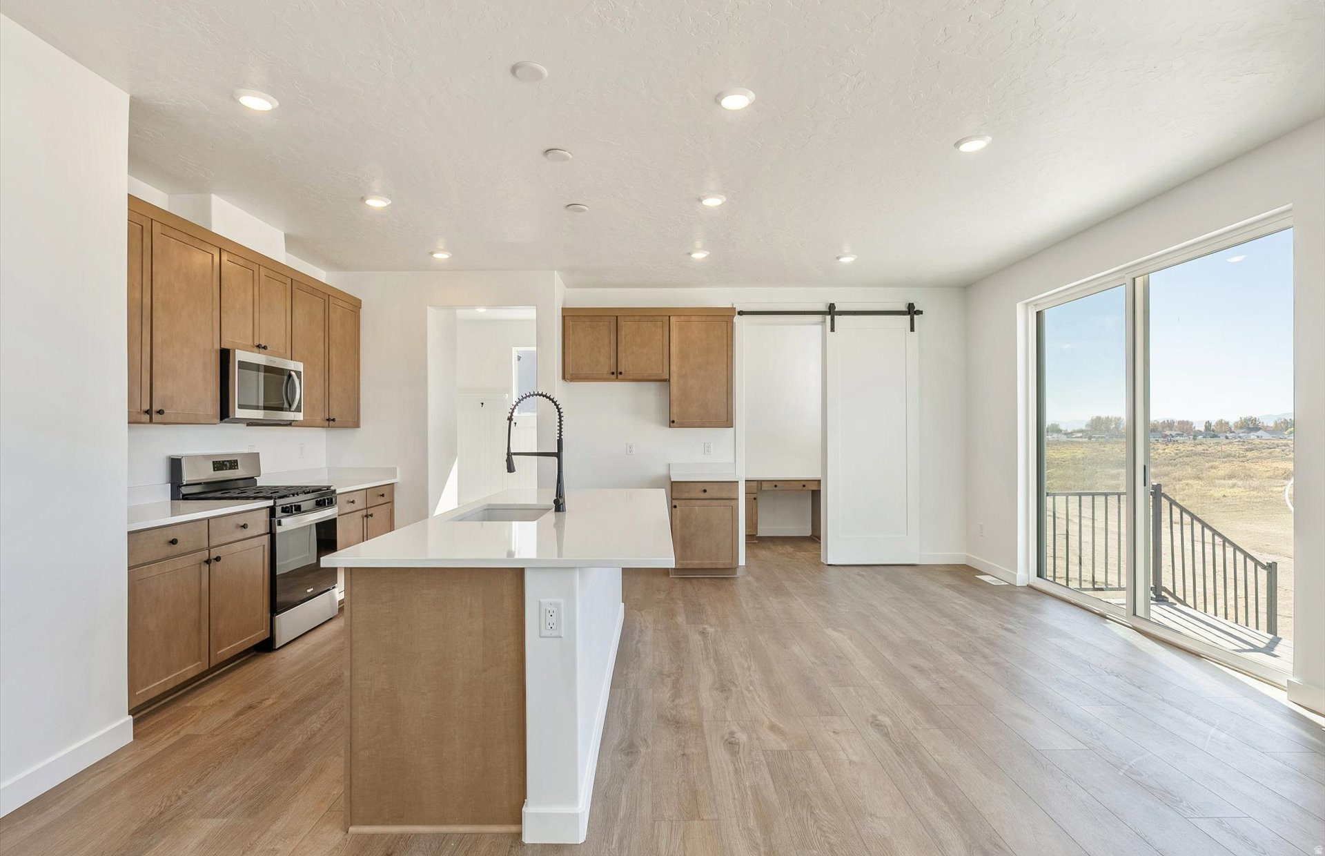 Completed Home! Interest Rates as low as 4.99% 30 YR FIXED w/ preferred lender on this quick close with the preferred lender! 2 story, 4 bedroom beautiful new home on 1/4 Acre Lot. This thoughtfully designed home features a 3-car garage, soaring ceilings in the family room that create an open to above atmosphere. Upgraded cabinets with quartz countertops throughout. The modern kitchen is equipped with stainless steel gas range stove, dishwasher and microwave. Island seating and a separate space for an office off the kitchen. Large office/flex room with French Doors on main floor. Mud room with built in bench. Large spacious laundry room next to upstairs bedrooms. The owner's suite offers a spacious walk-in shower, double sink vanity, and a spacious walk-in closet. Enjoy the beautifully landscaped front and side yard, ready for you to enjoy from day one.