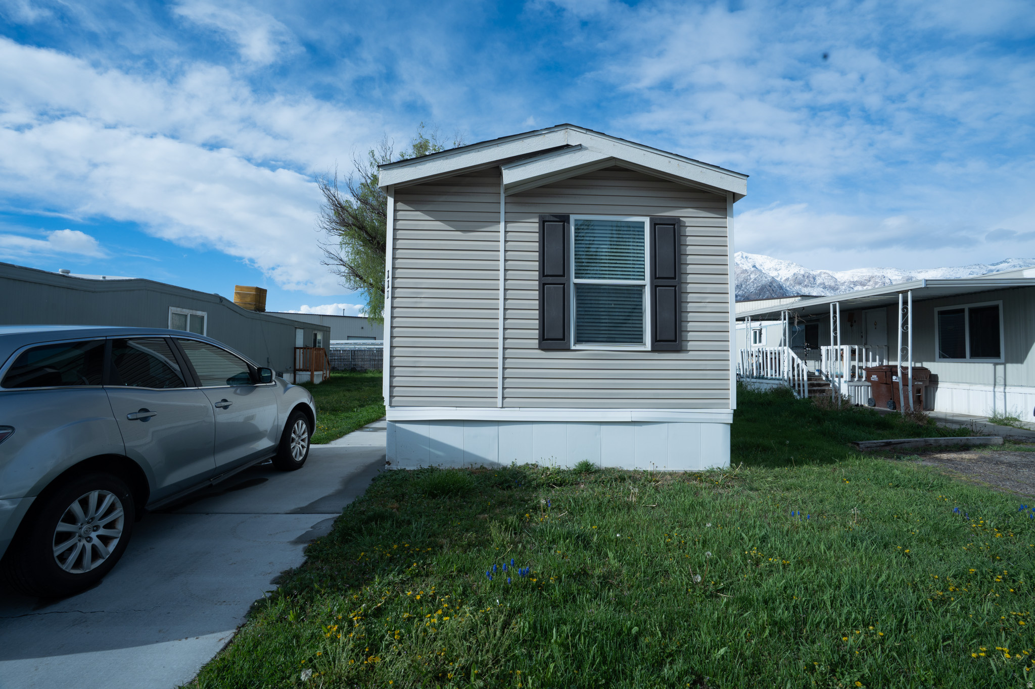 Step into something special in the sought-after Evergreen Village Community of Pleasant View! Built in 2020, this thoughtfully cared-for 3 bed, 2 bath home features a spacious open floor plan ideal for both relaxing and entertaining. Residents enjoy fantastic community amenities including a park, pool, and clubhouse. Quick access to I-15, plus shopping, schools, and everyday conveniences just minutes away. Schedule your private showing today. Square footage is a courtesy estimate obtained from Evergreen Village; buyer is advised to independently verify