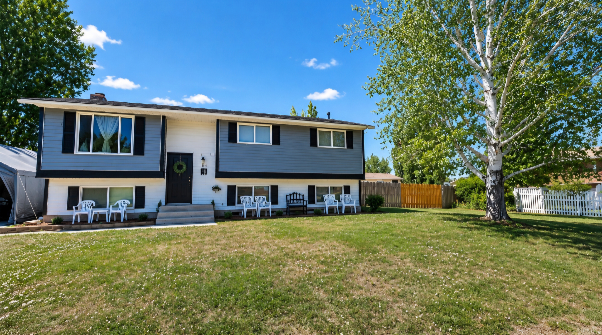 Welcome to this beautiful split-entry home in High Country Estates subdivision! Offering over 2,100 square feet of living space, this 3-bedroom, 2-bath home sits on a spacious 0.36-acre lot with mature trees, partial fencing, and scenic valley views. The bright and functional floor plan features a fully finished basement, updated finishes, and plenty of parking for toys and room for family living and entertaining.  Relax on the deck and take in the peaceful surroundings while being close to schools, shopping, and local amenities. A combination of space, comfort, and functionality-this home is a must-see! Buyer is advised to obtain independent information.