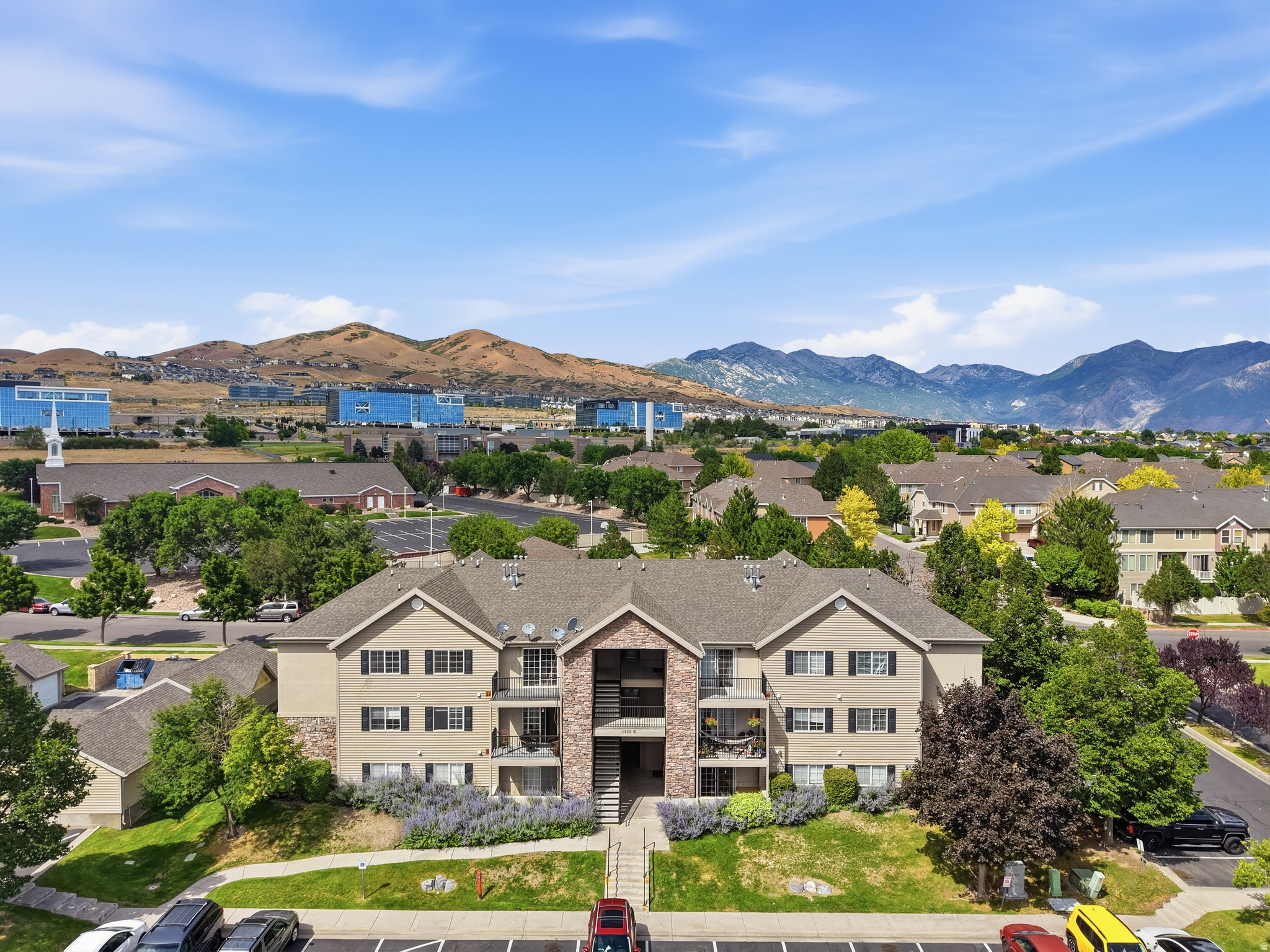 This 3-bedroom, 2-bath middle-level condo offers over 1,200 square feet of comfortable living in one of Lehi's most convenient locations. Being sold as-is, this home is priced with its cosmetic updates in mind, making it an incredible opportunity for first-time buyers, investors, or anyone looking to build equity with simple improvements. A fresh coat of paint and new flooring could completely transform the space. The major expense has already been taken care of with a brand-new furnace installed in 2025, giving buyers added peace of mind. Enjoy a spacious primary suite with a walk-in closet, a covered balcony with additional storage, a detached one-car garage plus an assigned parking space, and access to fantastic community amenities, including a clubhouse, fitness center, playground, pool, and walking trails! Located just minutes from Silicon Slopes, Traverse Mountain, shopping, dining, and freeway access, this is a rare opportunity to purchase in Lehi at an attractive price point and make the updates you want, rather than paying for someone else's finishes.   Square footage figures are provided as a courtesy estimate only. Buyer is advised to obtain an independent measurement.