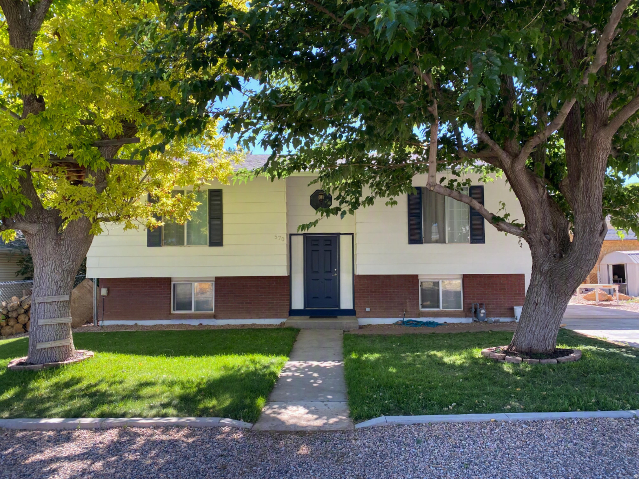 Welcome to this beautifully updated 4-bedroom, 2-bath home on a spacious quarter-acre lot in one of Parowan's most desirable neighborhoods. With thoughtful updates throughout and an incredible backyard, this home is truly move-in ready. Inside you'll find updated flooring, fresh paint, granite countertops, quality cabinetry, and a cozy fireplace that makes the living space warm and inviting. Step outside and enjoy one of the home's best features-a beautifully landscaped, fully fenced backyard with mature trees, fruit trees, berry patches, automatic sprinklers, beautiful rose bushes, a playhouse, and two storage sheds. Whether you're entertaining, gardening, or simply relaxing, this outdoor space is something special. Located on a quiet street close to schools, church, and with easy freeway access, this home also offers the convenience of being just 15 minutes from Brian Head for year-round recreation. If you've been looking for a home that's been lovingly cared for with a yard that's hard to find, this is one you won't want to miss. Schedule your showing today!