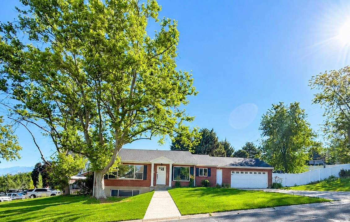 Meets the qualifications for ADU. Beautifully updated home located at 273 East Springhill Drive in North Salt Lake, offering both functionality and versatility on a desirable corner lot. This well-maintained property features a recently replaced roof and a new sewer line, providing peace of mind for future ownership. The home includes a fully equipped basement apartment with its own kitchen and private laundry, ideal for rental income or multigenerational living. A separate parking area on the side of the home offers convenience and added privacy for tenants. Situated in a quiet neighborhood, the property boasts a secluded, fully fenced backyard-perfect for outdoor enjoyment. Its prime location provides close proximity to daily amenities and quick freeway access, making commuting and errands effortless.