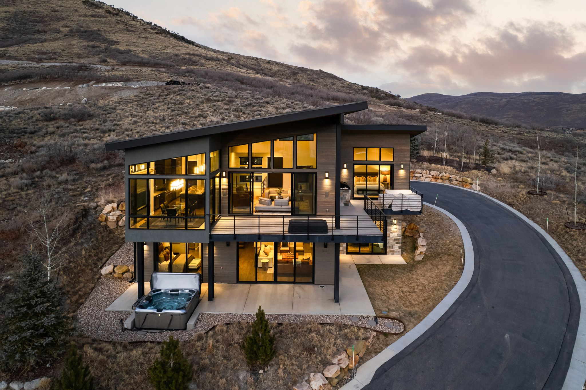 This stunning 4 bedroom home in SkyRidge offers breathtaking panoramic views of ski runs at Deer Valley East Village Resort and the tranquil waters of the Jordanelle. An executive kitchen, in home sauna, two steam showers, butler's pantry with espresso machine exercise room and an oversized 3 car garage.  The driveway wraps around to the back of the home for main level -kitchen, living, dining, primary suite. As part of the exclusive SkyRidge community, you'll have access to amenities that cater to your every need. Offering a shuttle service from home to slopes, golf and a state-of-the-art clubhouse to a full-service pro shop, golf simulators and a gourmet market cafe & iconic bar, every detail has been thoughtfully curated. And for those who seek a balanced lifestyle that seamlessly blends adventure with relaxation, SkyRidge Mountain Community offers the perfect home base with miles of  trails right outside your door for endless Park City exploring. Whether you're hitting the slopes at Deer Valley Resort, dining at world-class restaurants, or indulging in the vibrant cultural scene, this community provides the ideal backdrop for a life well-lived.