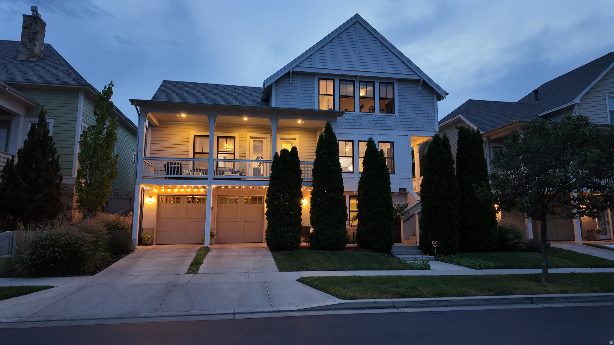 Luxury living for well under $1 million on a rare, tree-lined .17-acre lot, virtually impossible to find in this coveted community. Tucked away on a quiet street just steps from Oquirrh Lake, this custom three-story home offers incredible curb appeal with a full-length covered front porch. The park-like backyard is a private retreat featuring two spacious patios, towering mature trees, expansive green space, professional landscaping, and a gas hookup for your grill or fire pit, creating the feel of your own neighborhood park. Inside, soaring ceilings, oversized windows, and modern shiplap accents fill the home with natural light. The chef's kitchen is a showstopper with custom cabinetry, premium stainless steel appliances, a tile backsplash, and a massive center island with seating for six, perfect for gathering and entertaining. The open great room is anchored by a cozy gas fireplace and flows seamlessly onto a covered deck with spectacular Wasatch Mountain views. The main-level primary suite offers private deck access and a spa-inspired bath with a Euro glass shower, oversized soaking tub, and spacious walk-in closet. Upstairs you'll find three light-filled bedrooms with peeks of Oquirrh Lake and the beach, a full bath, and a versatile loft ideal for a home office, reading nook, or play area. The bright daylight walkout basement features a second gas fireplace with striking custom shiplap accent walls that continue into the basement bathroom. Designed with flexibility in mind, the lower level is ideally suited for a potential ADU and can be completely locked off from the main home. Complete with a front-facing garage and private driveway. Buyers to verify all information, including square footage. Owner is a licensed real estate agent in the State of Utah
