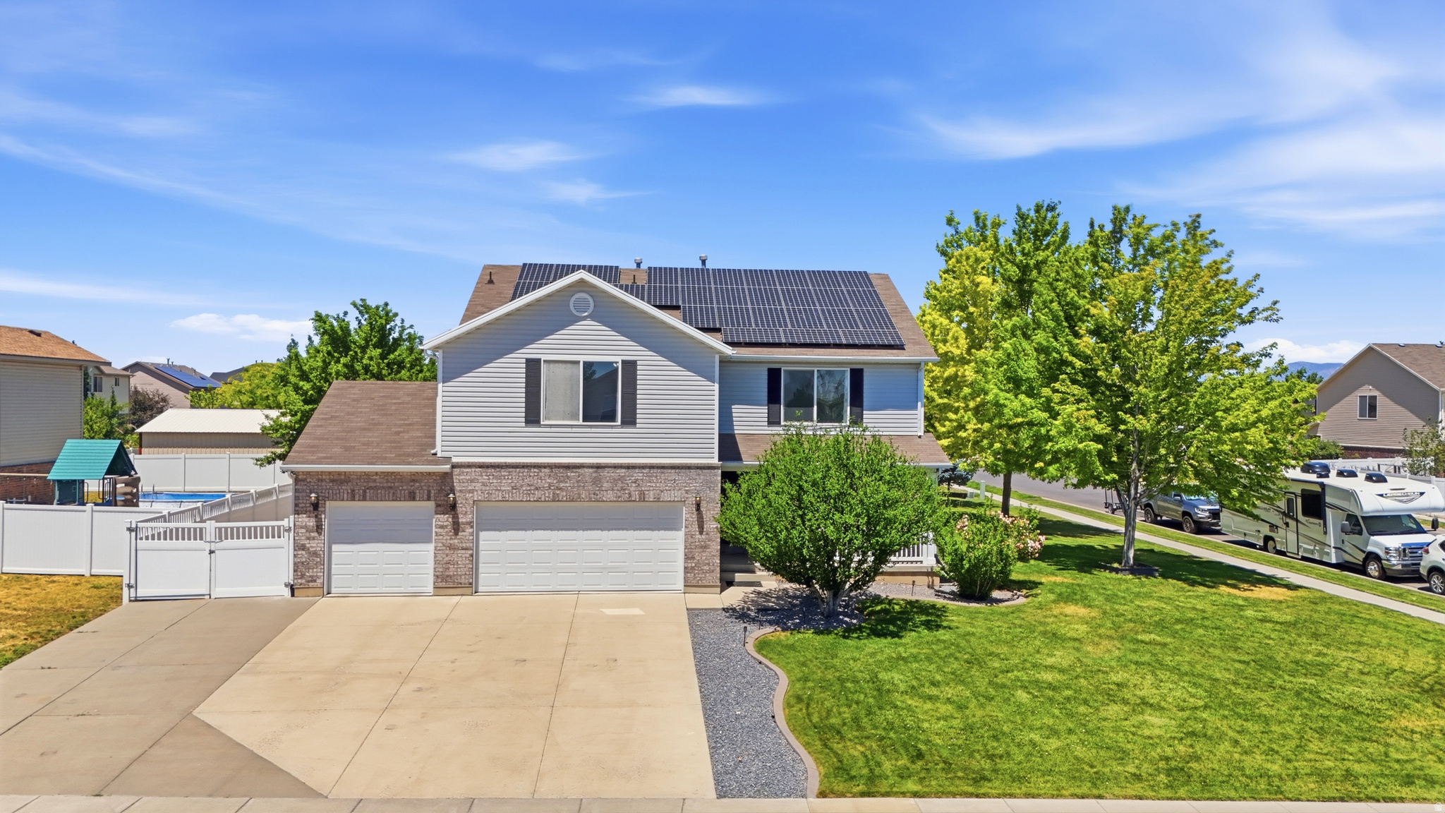 Beautiful Syracuse corner-lot home featuring paid-off solar panels, brand-new carpet and paint throughout, RV parking, and a 3-car garage. The open-concept floor plan offers a spacious kitchen with tons of cabinetry and counter space, flowing seamlessly into the dining and family room areas. Upstairs you'll find oversized bedrooms, including a large primary suite with an impressive walk-in closet. Enjoy the fully fenced backyard with mature landscaping, covered patio, hot tub area, storage shed, and ample space for entertaining. Conveniently located with quick freeway access and easy access to the new West Davis Corridor, making commuting throughout Northern Utah a breeze. Move-in ready and loaded with value!
