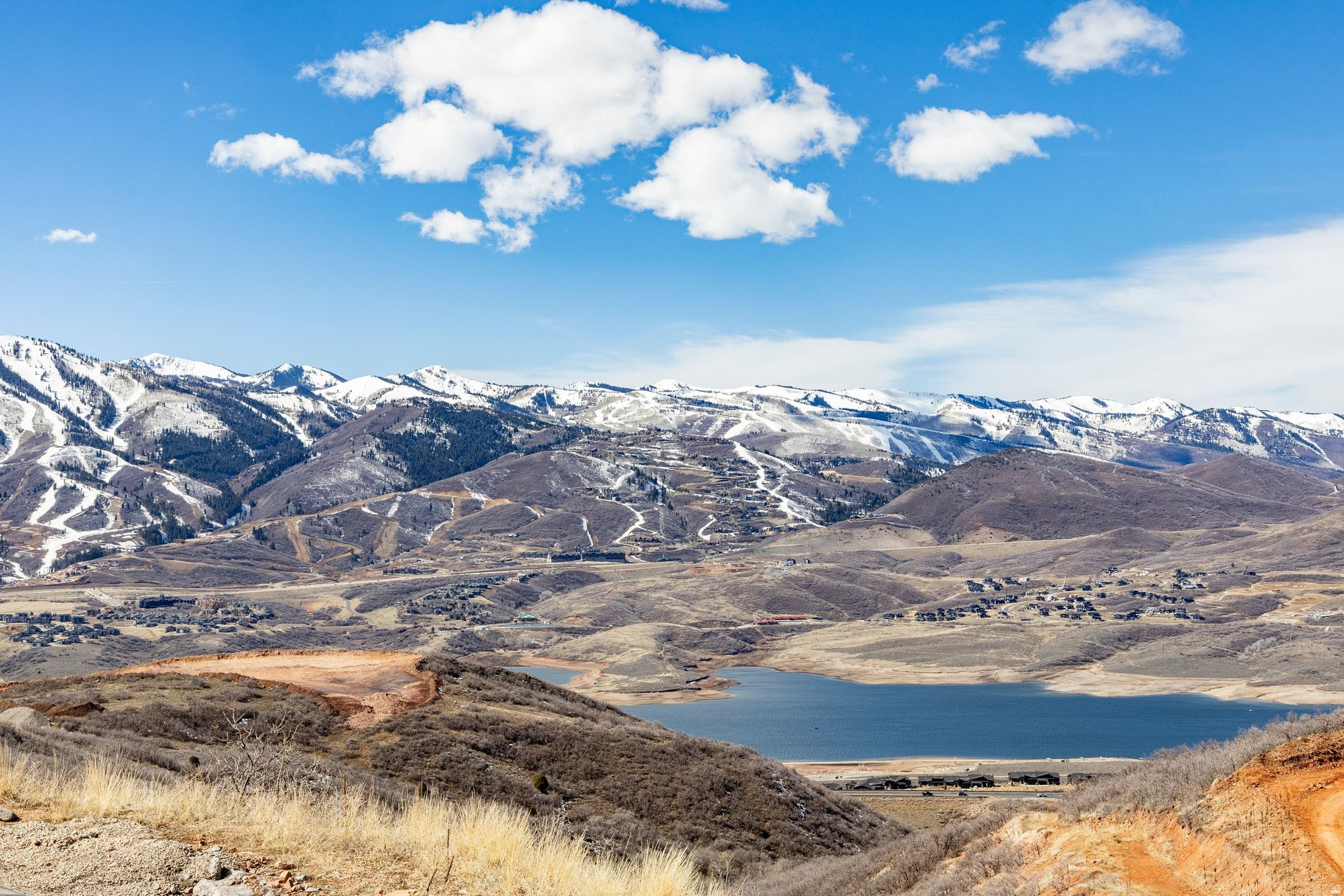 Perched above the shimmering waters of Jordanelle Reservoir, this exceptional 0.53-acre homesite in the prestigious Golden Eagle community of Hideout offers one of the most spectacular view corridors in the region. From its elevated vantage point, enjoy sweeping panoramas of Mount Timpanogos, the Deer Valley ski runs, the Cascades, and Jordanelle Reservoir-a dramatic view that changes beautifully with every season.  Golden Eagle is a 550-acre master-planned mountain enclave known for its high elevation, expansive open space, and thoughtfully positioned homesites designed to preserve privacy and maximize views.   Planned neighborhood amenities include future trail connections that will link Golden Eagle to the Soaring Hawk trail system, expanding access to miles of hiking and biking.  Located at approximately 6,900 feet in elevation, Hideout offers crisp mountain air, peaceful surroundings, and effortless access to year-round recreation. This homesite is just 16 minutes from Deer Valley's new East Village, 18 minutes to Park City's historic Main Street, and approximately 40 minutes to Salt Lake City International Airport, making it ideal for both full-time living and luxury mountain retreats.  Whether you envision a striking contemporary mountain residence or a timeless alpine getaway, Lot 41 presents a rare opportunity to build in one of the most scenic and well-positioned communities near Park City and Deer Valley.