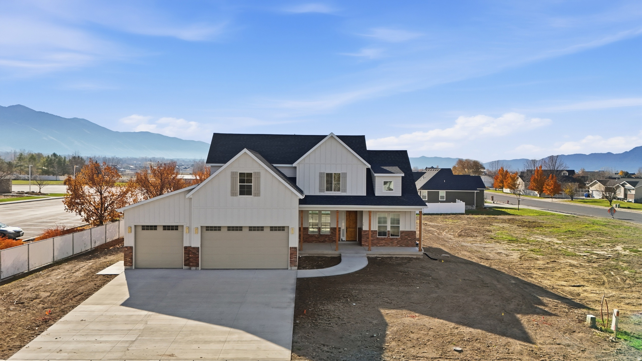 This exquisite custom-built home combines luxury, craftsmanship, and comfort in every detail. Step inside and you'll immediately notice the high-quality cabinetry with soft-close features, quartz countertops, and high-end appliances-all included. The open-concept kitchen flows seamlessly into the main living area, highlighted by custom knotty alder beams and a beautiful fireplace that make it the perfect gathering space.  A pocket door leads to the thoughtfully designed laundry and mudroom, while the large finished garage provides ample space for vehicles, storage, or even a workshop. Upstairs, a spacious bonus room offers endless possibilities for a playroom, gym, or office.  Enjoy Utah living at its finest with over 1,000 square feet of covered porches, a cedar-lined front porch ceiling, and a walk-out from the primary bedroom-all set on a flat, usable lot that's plumbed for a hot tub and secondary water. The brick exterior offers timeless curb appeal and durability.  Downstairs, you'll find two cold storage rooms and plumbing ready for an additional laundry setup, making this home as practical as it is beautiful.  From the custom handrails to the range hood and every thoughtful finish in between, this home stands out for its quality and attention to detail. This home is within walking distance of a new elementary school, middle school and high school. An adjacent lot is also available for purchase. Seller is willing to offer a interest rate buy down. He would also consider a buying a smaller home if someone has to sell theirs to buy this house. Incentives to use sellers preferred lender.