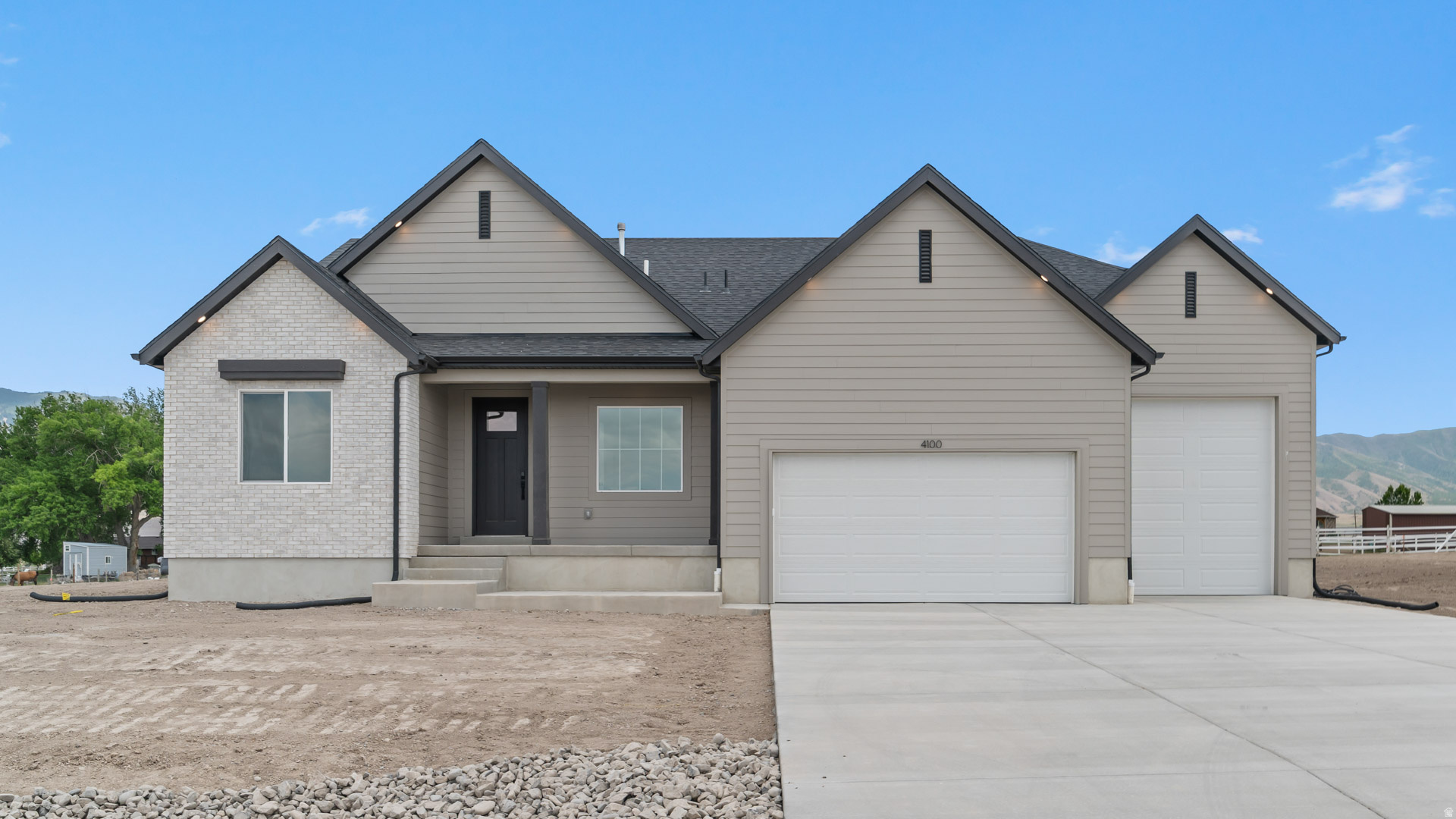 RILEY PARK IN ERDA 1 ACRE LOTS.  This home is under construction for a SEPTEMBER completion. This amazing OAKLEY floorplan sits on 1 full acre in Erda Utah. The main floor owner's suite has it all: tray ceiling, large walk-in closet, double undercounter sinks, soaker tub and oversized shower. Get cozy in the large family room around the fireplace. The open concept kitchen includes a large island for food prep/counter seating, a large walk-in pantry, kitchen with gas cooktop, 42" upper cabinets w/ crown molding, 30" Single sink, upgraded cabinet with dovetail, soft-close features. Laminate floor throughout the kitchen, dining, & family room. Quartz countertop in kitchen and bathrooms, Powder room located next to the garage entry and mud room bench. Stair railing with newel posts. Home includes unfinished basement with 9' foundation walls, room for a large family room, 3 additional bedrooms, a bathroom, and under porch storage. 95% efficient furnaces, 50-gallon water heater, & plumbed for a soft-water system. 3-car RV garage with 12' x 10' door and extra space on the side of the garage to add an RV pad. Ask me about our generous home warranties, active radon Mitigation System, and Smart Home Package, which is included in this home. The actual home may differ in color, material, and/or options. Pictures are of a finished home of the same floorplan, and the available home may contain different options, upgrades, and exterior color and/or elevation style. Square footage figures are provided as a courtesy estimate only and were obtained from building plans. No representation or warranties are made regarding school districts and assignments; please conduct your own investigation regarding current/future school boundaries.