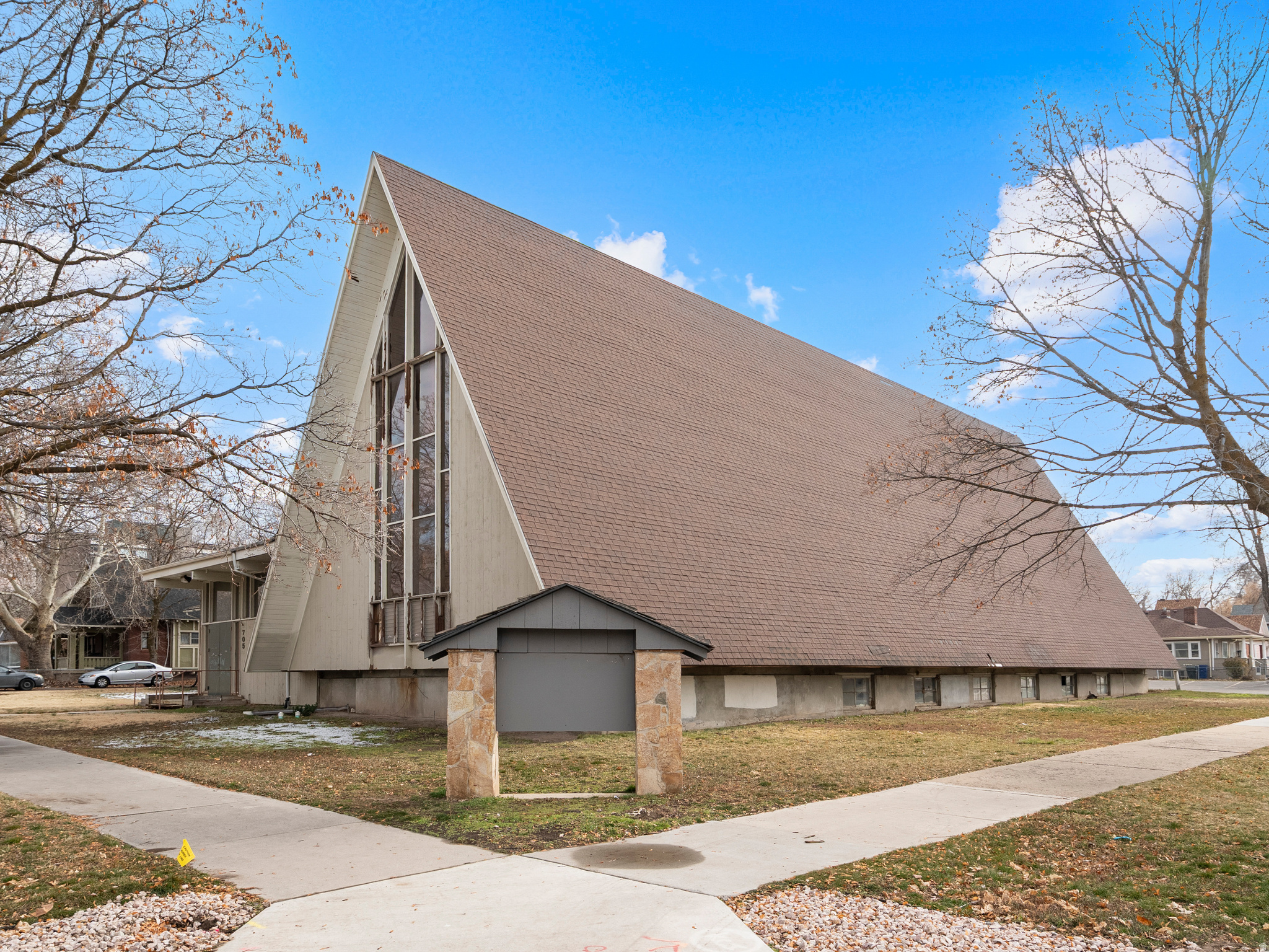 Development opportunity on 0.92 acres zoned R-3EC in Ogden. Former 20,232 SF church (1960 build) is no longer in use; value is primarily in redevelopment potential. Prior CUP approved for medical/professional use with site plans and schematics available. Zoning may also allow townhome development (approx. up to 20 units buyer to verify). OPEN TO ALL OPTIONS sell/lease.  Buyer to verify all development potential.  LEASE OPTION - Owner is willing to work out a build to suit NNN lease. Inquire for details regarding lease price/terms.