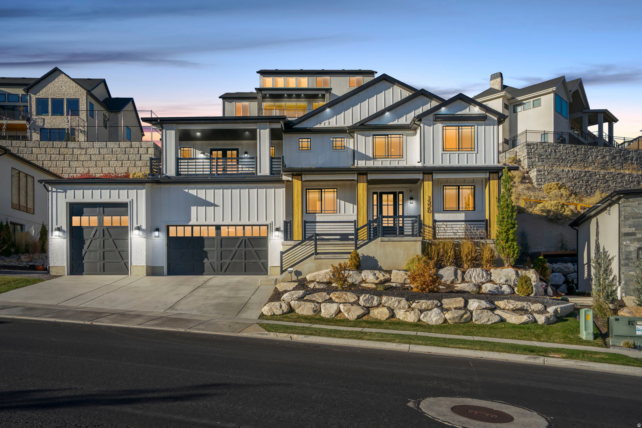 100K Price Reduction! Even though comps support the value! Silicon Slopes Perfection! LOCATION LOCATION! This thoughtfully designed modern home blends timeless style with everyday convenience, featuring 18' ceilings, custom finishes, and an open concept floorplan. Inside, you'll find a stunning statement fireplace with floor-to-ceiling shiplap, quartz countertops, durable LVP flooring, and soft-close two-tone cabinetry. The kitchen is equipped with premium KitchenAid appliances, a custom range hood, open shelving and ample storage. Upstairs, the primary suite is your private retreat with a spa-style bath, custom closet, and a balcony showcasing mountain and incredible valley and lake views. The finished basement offers a fitness room, surround sound system, and flexible living space for work or play. Step outside to your private oasis-designed for low maintenance and maximum relaxation. Enjoy a built-in BBQ area, and thoughtfully designed landscaping that gives you all the beauty with none of the weekend yard work. Perfect for the busy homeowner who wants to unwind, entertain, or simply enjoy peaceful evenings outdoors. Home comes equipped with smart lighting and exterior Christmas light outlet with timers! Schedule your private showing today and experience effortless luxury living.
