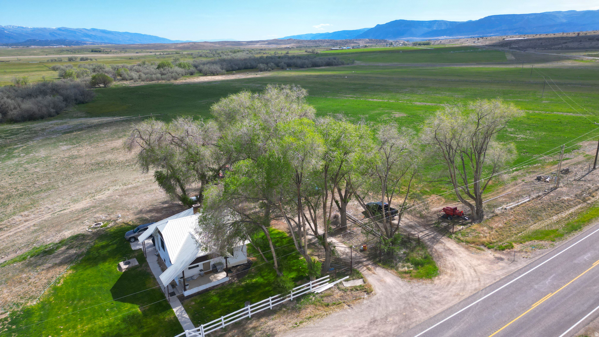 Discover a rare opportunity to own 60.13 acres of scenic Utah countryside where the beautiful Sanpitch River winds gracefully through the property, creating a peaceful setting rich with wildlife, open space, and endless possibilities. This exceptional Mt. Pleasant ranchette combines productive farmland, breathtaking views, and comfortable rural living all in one remarkable property. The 2,016 sq. ft. home offers country charm with modern comfort, perfectly positioned to enjoy panoramic mountain and valley views in every direction. Whether you're looking for a working farm, horse property, recreational retreat, corporate retreat, air bnb, or private homestead, this property offers the versatility to fit your vision. Included are 61.50 irrigation water shares through the McArthur Frandsen Ditch Company along with three wheel lines, providing valuable water resources for farming, ranching, or pasture use. The river corridor attracts abundant wildlife year-round, including deer, wild turkeys, and seasonal elk, creating an incredible natural backdrop right outside your door. Properties offering this combination of usable acreage, irrigation water, river frontage, wildlife, and a move-in-ready home are increasingly hard to find. Experience the beauty, privacy, and lifestyle that country living in Mt. Pleasant has to offer.  Square footage figures are provided as a courtesy estimate only and were obtained from county records. Buyer is advised to obtain an independent measurement.