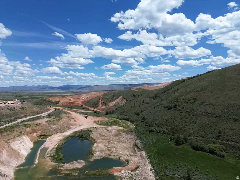Exceptional opportunity to acquire a 59.25-acre aggregate operation located in scenic Worm Creek Canyon near Bear Lake. This established gravel pit serves as a valuable resource for both large- and small-scale construction projects throughout the region. The property offers a diverse range of aggregate materials, including sand, gravel, fill dirt, and boulders, meeting the needs of contractors, developers, and builders. In addition to its commercial value, the property includes water shares and an artesian pond. Power is available nearby along the road, providing convenient access for future improvements or expansion. Parcels 4736.01 and 4738.00 also included making the total acreage 59.25.
