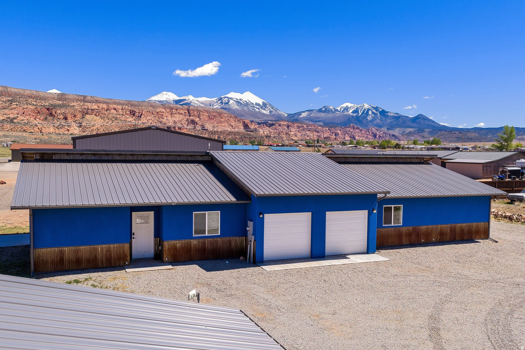 Excellent opportunity for investors to own a well-built, income-producing duplex in Spanish Valley. Each unit offers 3 bedrooms, 2 bathrooms, and approximately 1,300 sq ft of thoughtfully designed, open-concept living space filled with ample natural light. Durable concrete floors and energy-efficient mini-split systems in every room provide low maintenance and year-round comfort. Interior features include a walk-in closet and double vanity in the primary suite, and a heavily insulated dividing wall that allows each unit to live like its own private residence. Both units enjoy private patios, ample parking, and an added RV hookup for flexibility and additional use. Set against a backdrop of stunning red rock and mountain views, this property combines functionality, privacy, and strong rental appeal. The neighboring duplex is also available, opening the door to multiple possibilities-live in one unit while generating income from the other, secure the adjacent property for four turnkey rentals, or create your own Moab base camp. Whether you're investing or looking for an owner-occupied setup, this is a versatile opportunity with excellent potential!