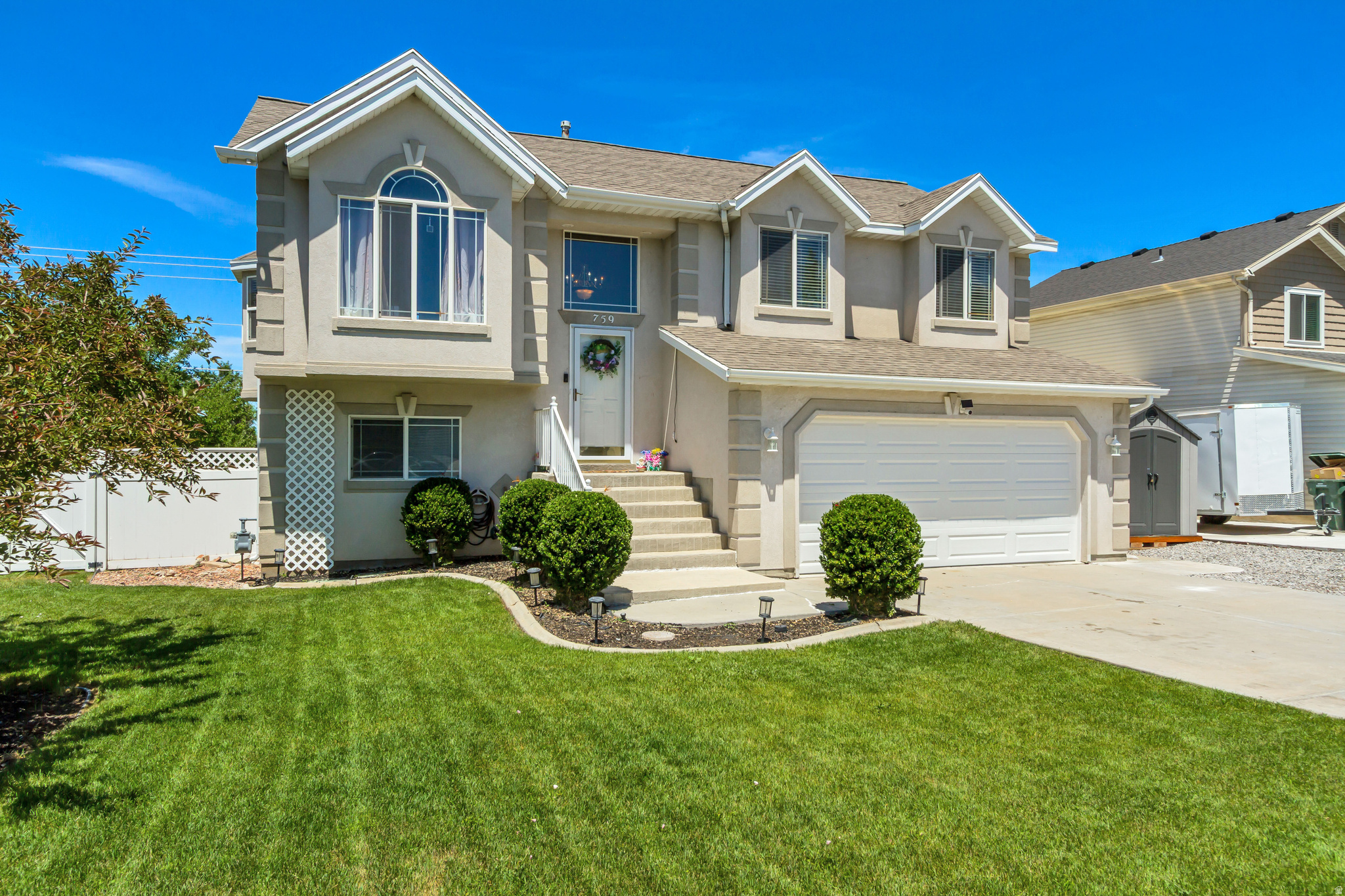 Welcome home to this beautifully maintained Tooele gem, where comfort, convenience, and breathtaking views come together. Ideally situated just minutes from parks, schools, shopping, and endless outdoor recreation, this home offers the perfect balance of everyday living and adventure.  Step inside to discover soaring vaulted ceilings, beautiful bay windows that fill the home with natural light, and a thoughtfully designed floor plan that provides both space and functionality. With two inviting living areas, three spacious bedrooms, and two well-appointed bathrooms, there's plenty of room to relax, entertain, and make lasting memories.  Outside is where this property truly shines. The meticulously cared-for yard is a private retreat featuring mature trees, colorful landscaping, and lush gardens. Enjoy your morning coffee or unwind after a long day from the deck or patio while taking in panoramic views of the Great Salt Lake, the Tooele Valley, and the surrounding mountains.  Homes that have been cared for this well don't come along often. If you're looking for a move-in-ready property with incredible outdoor living and a location that puts everything within easy reach, this is one you won't want to miss.  Square footage figures are provided as a courtesy estimate only and were obtained from county records. Buyer is advised to obtain an independent measurement.