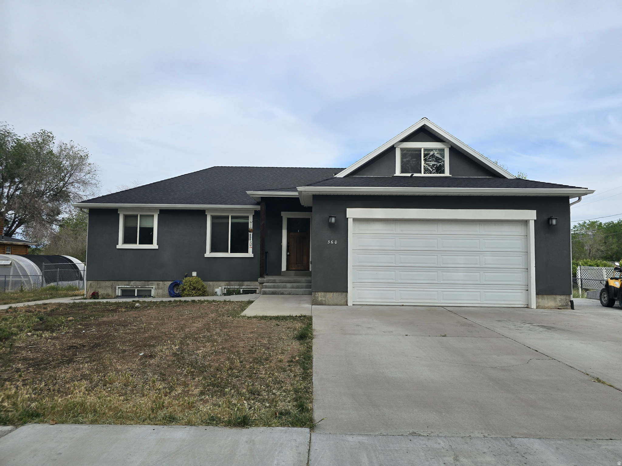 This spacious home features 5 bedrooms, 3 full bathrooms, and a bonus room above the garage. Situated on 0.49 acres, the property includes 0.49 shares of irrigation water. The basement offers a separate outside entrance and a full kitchen, making it an ideal setup for a rental opportunity or guest quarters. Home is easy to show. Buyer to verify all.