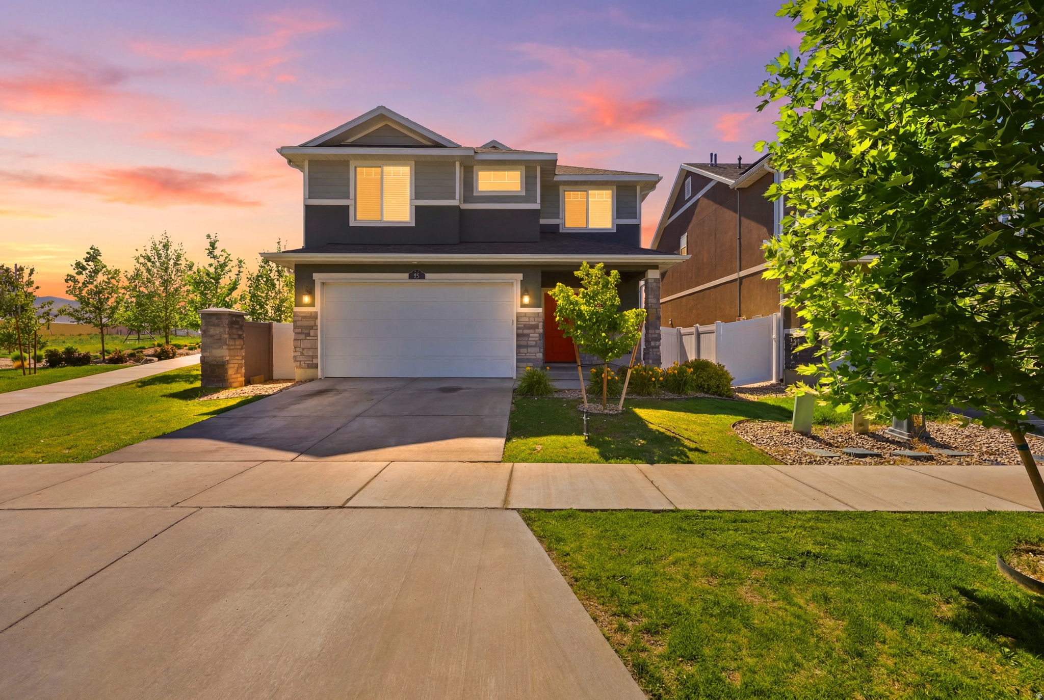 Welcome to this beautifully maintained Hudson floor plan in the desirable Wander Phase 2 community by Oakwood Homes. Better than new construction, this move-in ready home offers thoughtful upgrades throughout, including quartz countertops, upgraded cabinetry, black stainless steel appliances, laminate flooring on the main level, a gas range connection, upgraded lighting and fixtures, and a tankless water heater. The open-concept layout provides comfortable living spaces, mountain views, and an upstairs den with flexibility for a future fourth bedroom. Outside, enjoy a fully finished backyard featuring a covered patio, brick fire pit patio, raised garden beds, drip irrigation, holiday lighting outlets, and an included Lifetime playset. Conveniently located near Saratoga Springs' newest shopping, dining, walking trails, the Jordan River Parkway, and community pool amenities, this home offers the perfect blend of comfort, convenience, and outdoor living.