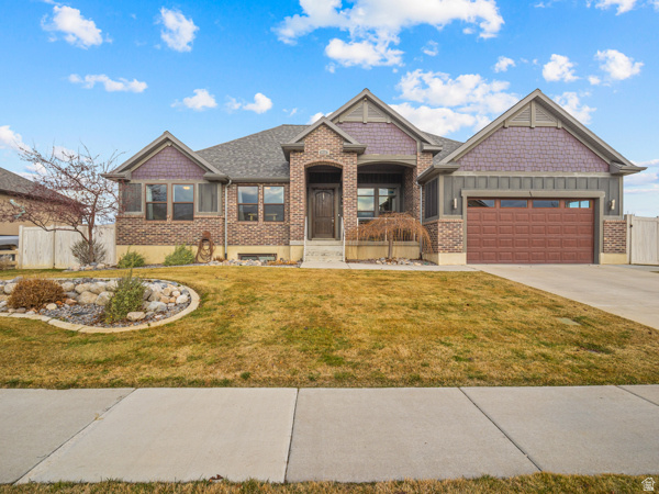 A rare Lehi property offering space, versatility, and exceptional upkeep on a beautiful half acre lot (with animal rights). This nearly 4,500 sq. ft. home (with an additional ~1000 sq ft in the shop) features 6 bedrooms, 3.5 bathrooms, and a bright, open floorplan ideal for both everyday living and entertaining. Pride of ownership is evident throughout, with a new roof installed in 2024, central vacuum, and thoughtful design details that make this home truly move-in ready.  The basement is designed for enjoyment and functionality, featuring a dedicated theater room and a secure gun room for safe storage.  Step outside and find yourself looking at a large detached garage offering incredible flexibility for hobbies, storage, or business use. Above the garage you'll find a 24' x 40' finished space perfect for a home office, gym, studio, or entertainment space.  Located just minutes from shopping, dining, schools, tech corridors, and freeway access, this property delivers rare land, exceptional amenities, and an unbeatable Lehi location. Plenty of room for toys, trailers, RVs, gardens, or future expansion. Rare opportunity combining land, square footage, and functional outbuildings in Lehi!