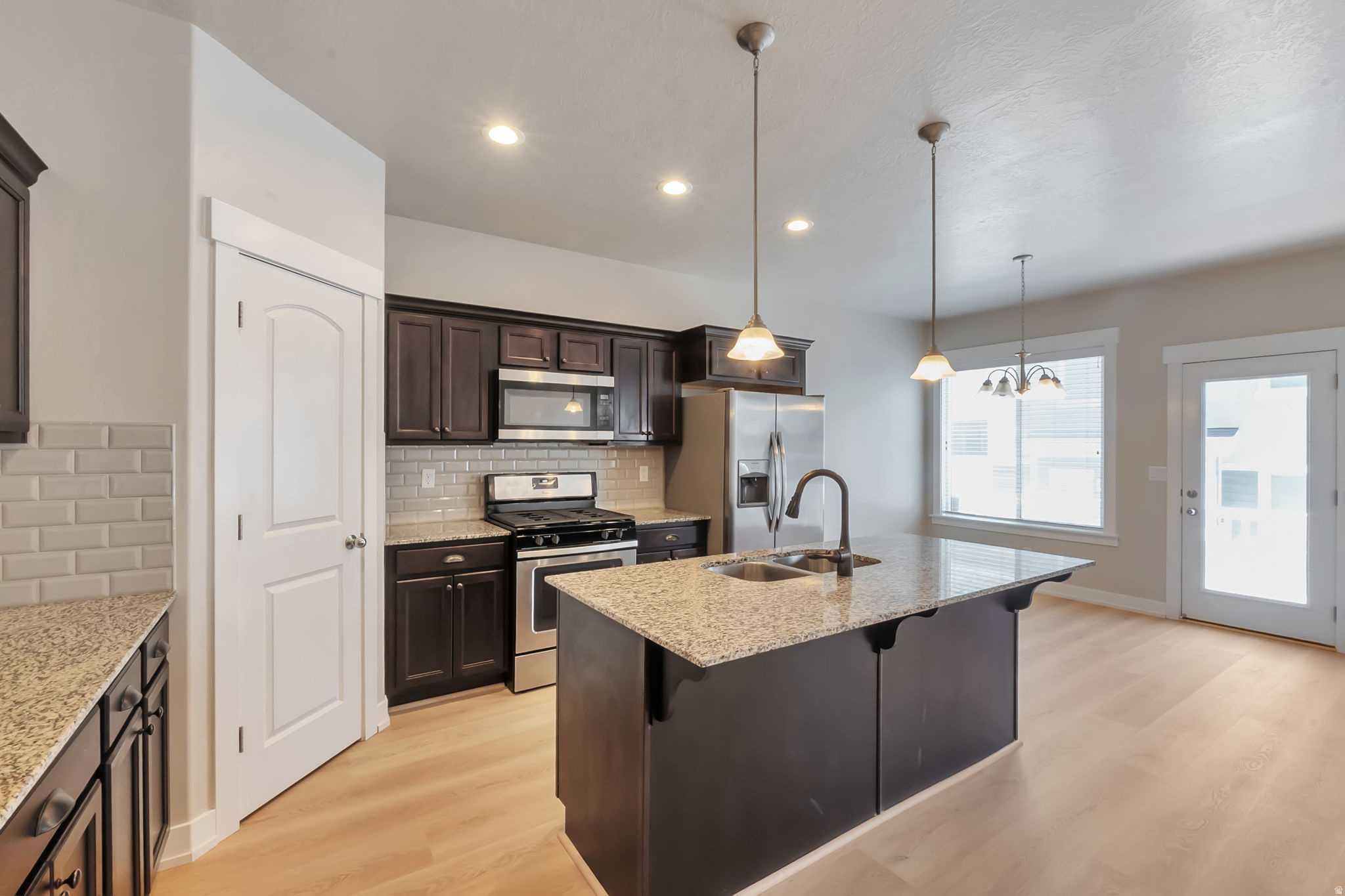 Wow-this beautiful 4-bedroom, 3-bath townhome offers the perfect blend of comfort, convenience, and value, all at a new price! Featuring brand new carpet and stylish new LVP flooring, the home feels fresh, modern, and truly move-in ready. Bright and inviting living spaces are filled with natural light, creating a warm and welcoming atmosphere throughout. The unfinished basement provides incredible potential to customize-add a spacious family room, a 4th bedroom, or whatever suits your lifestyle. Ideally located in the heart of Lehi with quick freeway access, commuting is a breeze, and you're just minutes from top shopping, dining, entertainment, and the new Primary Children's Medical Center. Enjoy fantastic community amenities including a clubhouse, pool, and pickleball courts. If you're looking for a quick move-in home in a thriving, convenient area, this one checks all the boxes!