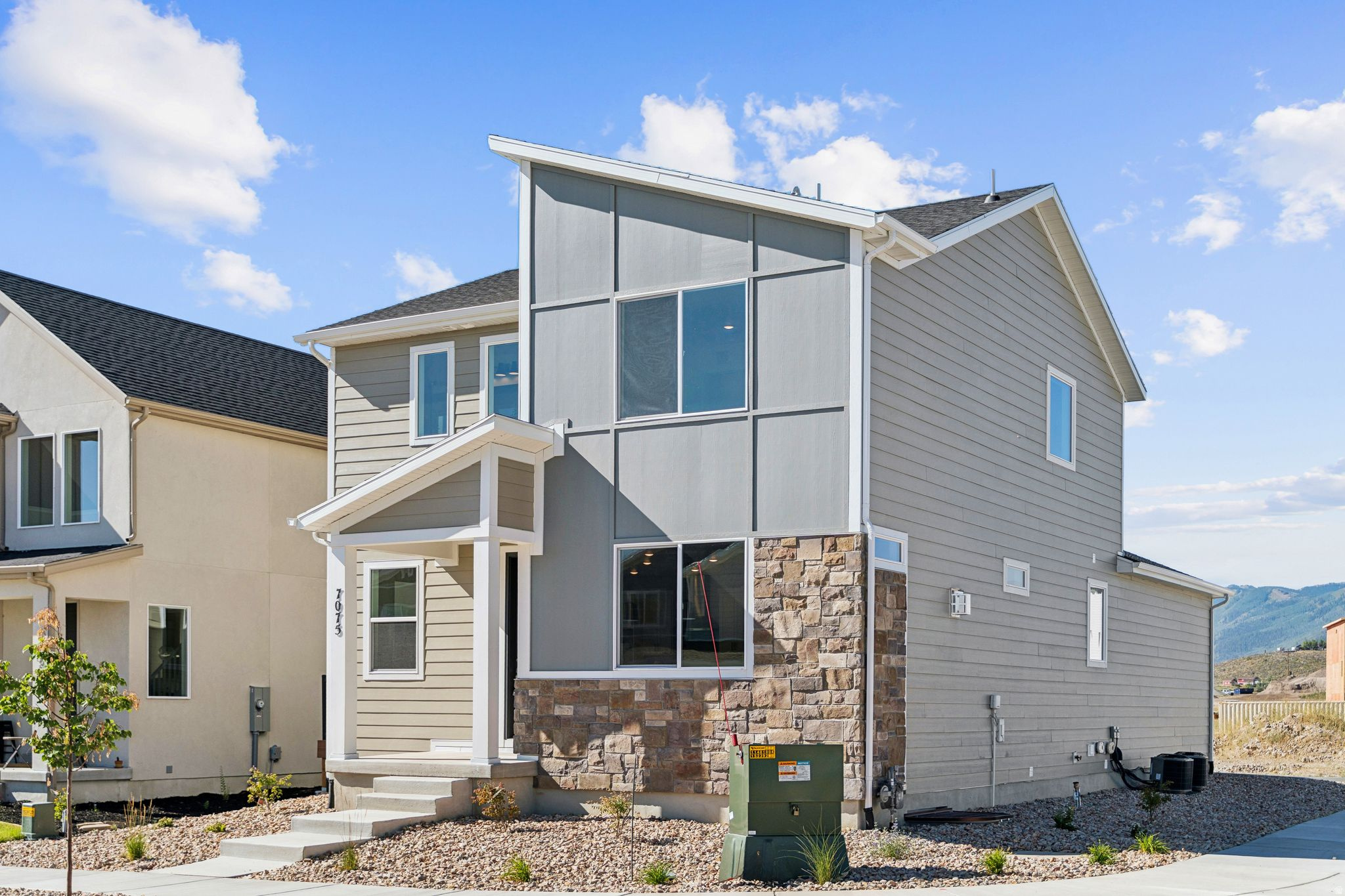 Discover this stunning corner-lot home in one of Park City's newest and most desirable communities, Silver Creek Village. Designed with comfort and style in mind, this open-concept floor plan invites you to gather in the living room around the fireplace, while the gourmet kitchen impresses with upgraded LG stainless steel appliances, a gas range with vented hood, double ovens, sleek quartz countertops, and timeless shaker-style cabinets. Upstairs, you'll find three spacious bedrooms, including the primary suite featuring a walk-in closet, dual vanities, and a private water closet.A true standout is the 1-bedroom, 1-bathroom ADU apartment in the basement with its own dedicated exterior entrance -- perfect for rental income under Summit County's Workforce Housing guidelines. Additional highlights include a high-efficiency HVAC system and tankless water heater for year-round comfort. Here, you're just 30 minutes from the Salt Lake International Airport, moments from world-class skiing, hiking, and mountain biking trails, while enjoying the peace and quiet of this sought-after neighborhood. Schedule your showing today and experience the best of Park City mountain living with unmatched accessibility to its amenities.