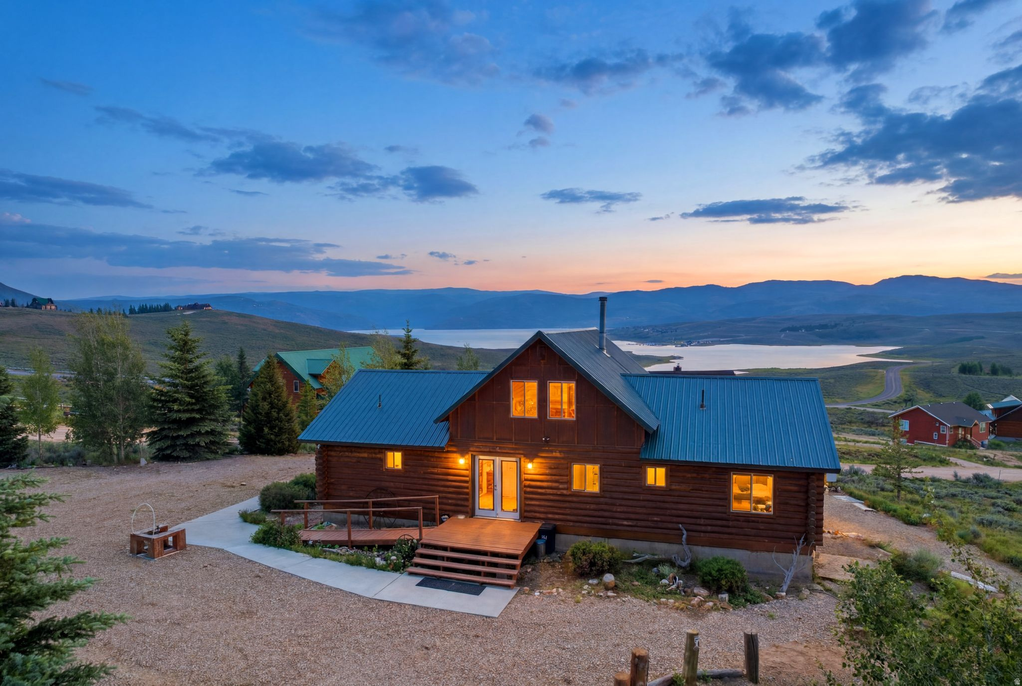 Built in 2001, this turnkey furnished log cabin offers unobstructed Soldier Creek Reservoir views from a private 1.35-acre setting just inside the Strawberry Lakeview gate and only  mile from Soldier Creek Marina. Designed for recreation and entertaining, the open floor plan features vaulted ceilings, a wood-burning fireplace, spacious gathering areas, and a large loft providing additional living and sleeping space. Additionally, this cabin offers wheelchair accessibility on the ground level and a roll-in shower for special needs. The main-level primary suite offers privacy and comfort, while a 2nd bedroom and full bath on the main level accommodate family and guests. The sunny walk-out basement includes a finished bedroom and handicap-accessible 3-piece bath, plus unfinished space for a future 4th bedroom and family room, creating an excellent opportunity for added equity and customization. Expansive decking captures breathtaking 180-degree lake and mountain views with exceptional privacy. A large graveled driveway and parking area easily accommodate multiple vehicles, boats, campers, trailers, snowmobiles, and recreational toys. Winter access includes nearby seasonal parking and groomed snowmobile trails to Soldier Creek Marina for a hot meal after a day of snowmobiling or ice fishing. Enjoy boating, fishing, hunting, ATV riding, hiking, and year-round recreation just minutes away. Conveniently located 30 min to Heber City, 45 min to Park City, 1 hr to Provo, and approx. 75 min to Salt Lake City.