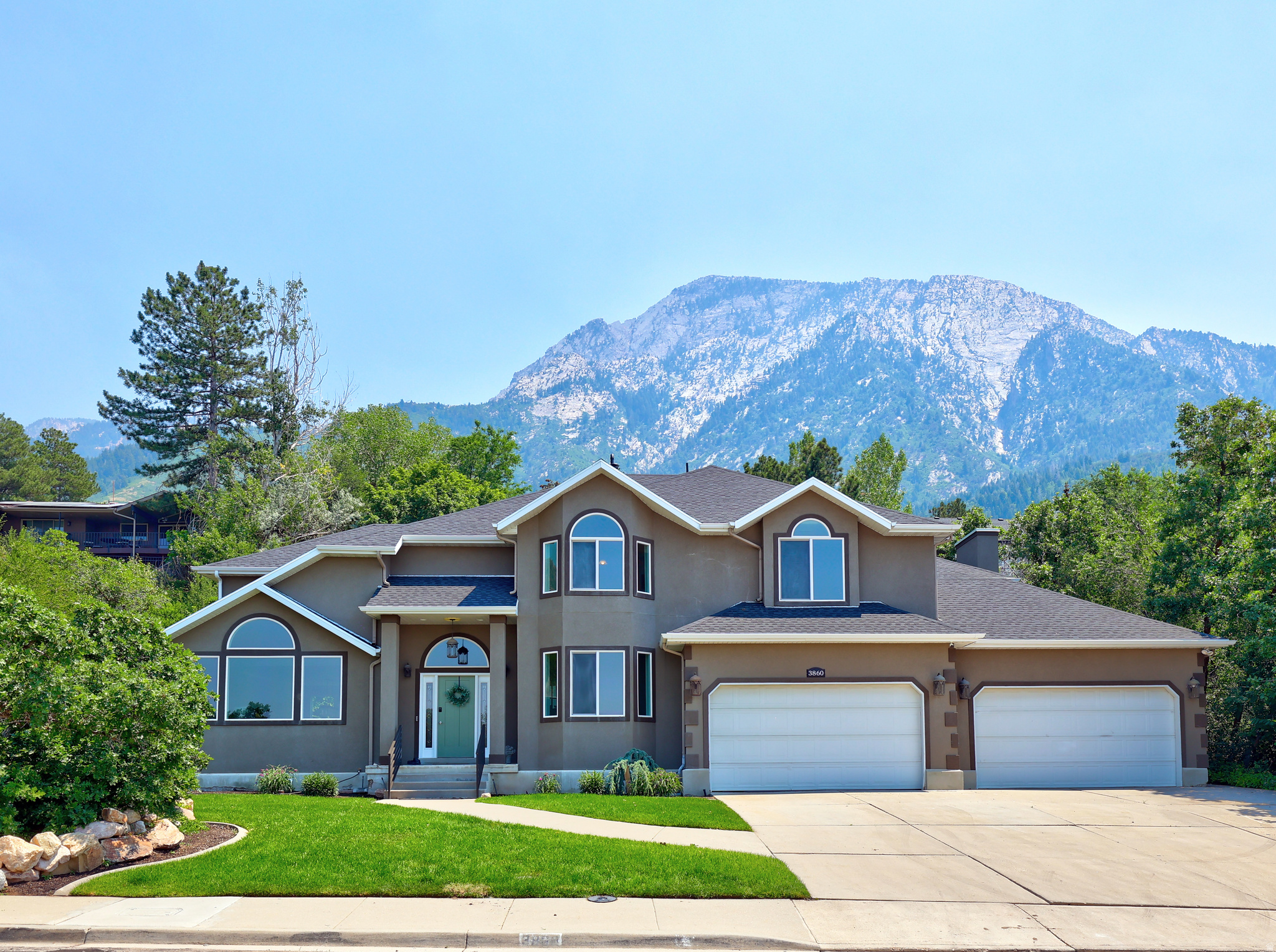 ** Stunning Custom Home in Olympus Cove **  Nestled at the base of Mt. Olympus in Salt Lake City's prestigious Olympus Cove neighborhood, this spacious custom home delivers breathtaking Mountain, Valley, and City views. Perfectly positioned to capture dramatic sunrises and sparkling city lights, the property features mature trees, lush landscaping, and a serene, park-like setting with easy access to hiking trails, shopping, and downtown.Thoughtfully updated throughout with elegant finishes, the home offers an open, inviting layout ideal for both daily living and entertaining. Recent updates include a brand-new roof.   Additional highlights include a spacious 4-car garage and generous, flowing living spaces. A standout feature is the fully finished 2-bedroom basement apartment with its own private entrance - ideal for extended family, guests, or supplemental rental income. Combining timeless craftsmanship, exceptional updates, and one of Salt Lake Valley's most desirable foothill locations, this rare Olympus Cove home is perfect as a forever residence or strong investment property. Ready for a private showing? Contact us today.