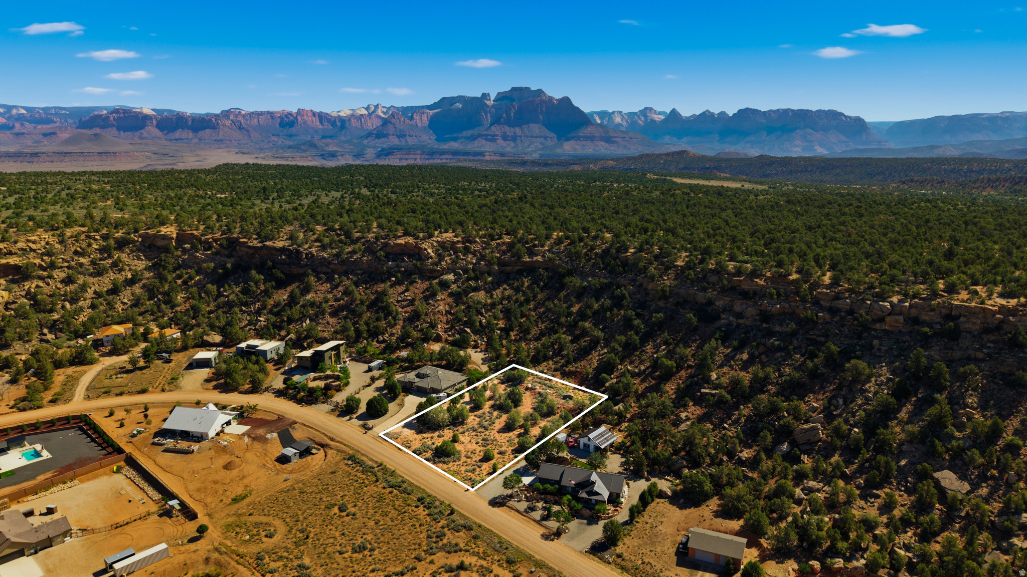 Discover the opportunity to build your dream home on this stunning 1.09-acre lot in the scenic community of Apple Valley, Utah. Surrounded by the natural beauty Southern Utah is known for, this property offers breathtaking views of Kolob Canyon and nearby Zion National Park, creating a backdrop that truly sets this homesite apart.  What makes this lot special is its character and charm - mature trees, natural rock formations, and unique terrain combine to create a homesite that feels private, peaceful, and connected to the landscape. Whether you envision a luxury desert retreat, a vacation getaway, or a full-time residence, this property provides the perfect canvas to bring your vision to life.  Outdoor enthusiasts will love the proximity to some of Southern Utah's best recreation. Located just minutes from world-class mountain biking trails at Gooseberry Mesa, nearby ATV and off-road trail systems, hiking, camping, and endless outdoor adventure, this location offers the ultimate Southern Utah lifestyle. Zion National Park is also just a short drive away, making weekend adventures easier than ever.  Enjoy the serenity of Apple Valley while still having convenient access to Hurricane, St. George, shopping, dining, and everyday amenities. Opportunities like this are becoming harder to find - especially lots with this much personality, scenery, and access to recreation.  Come walk the property and experience the beauty for yourself.  All information in this listing is deemed reliable but not guaranteed; buyer or buyer's agent to verify all information to their satisfaction.