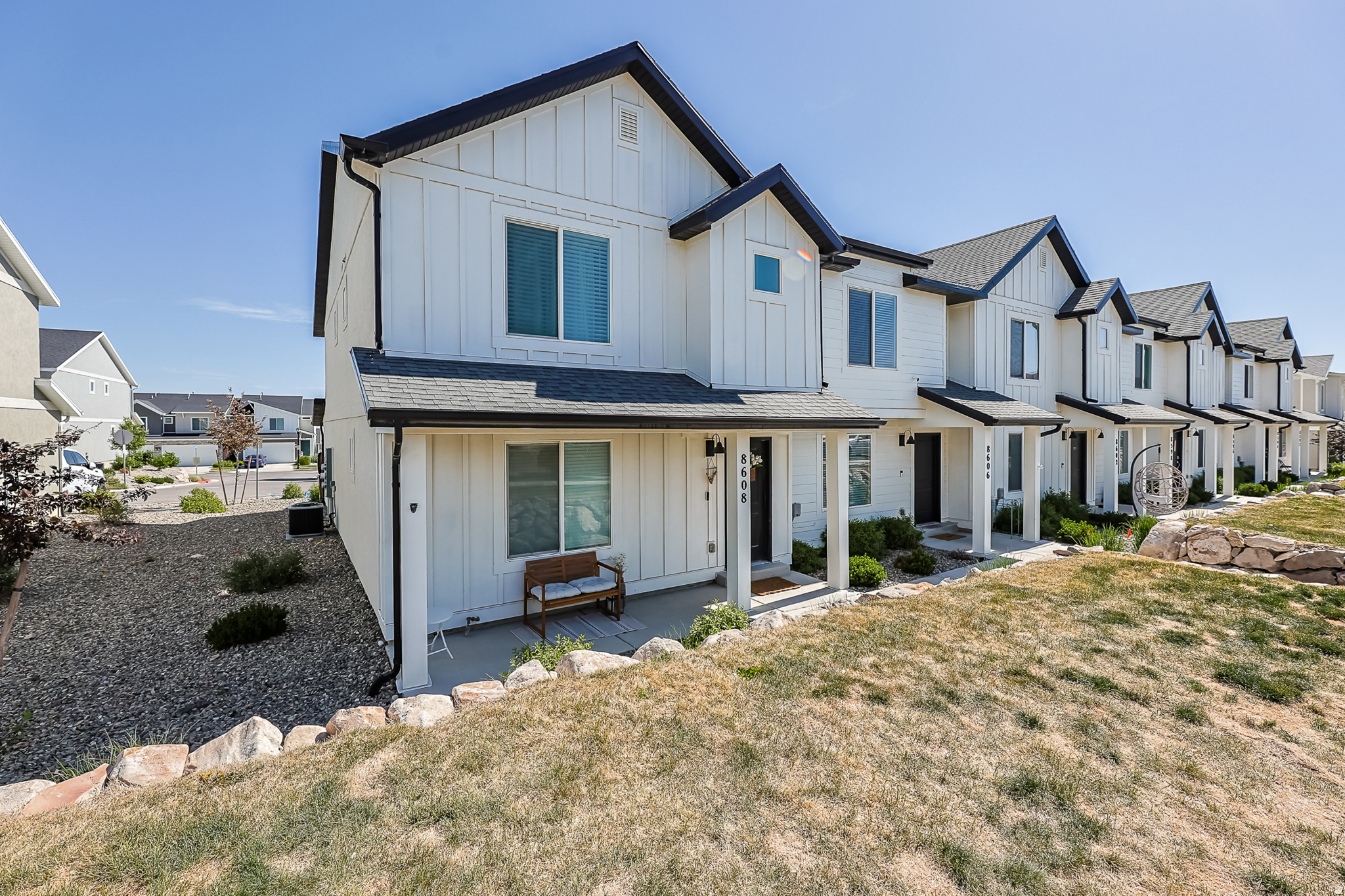 Welcome home to this darling farmhouse-style end-row townhome in the sought-after Little Gateway community in the heart of Magna! This like-new 3-bedroom, 2-bath beauty offers the perfect blend of charm, comfort, and low-maintenance living.  One of the standout features not highlighted in the listing is the large concrete crawl space complete with electrical ideal for extra storage.  Enjoy all the incredible community amenities Little Gateway has to offer, including a pool, basketball courts, pickleball courts, and a beautiful clubhouse. Conveniently located near shopping, dining, parks, and commuter access, this home truly has it all.
