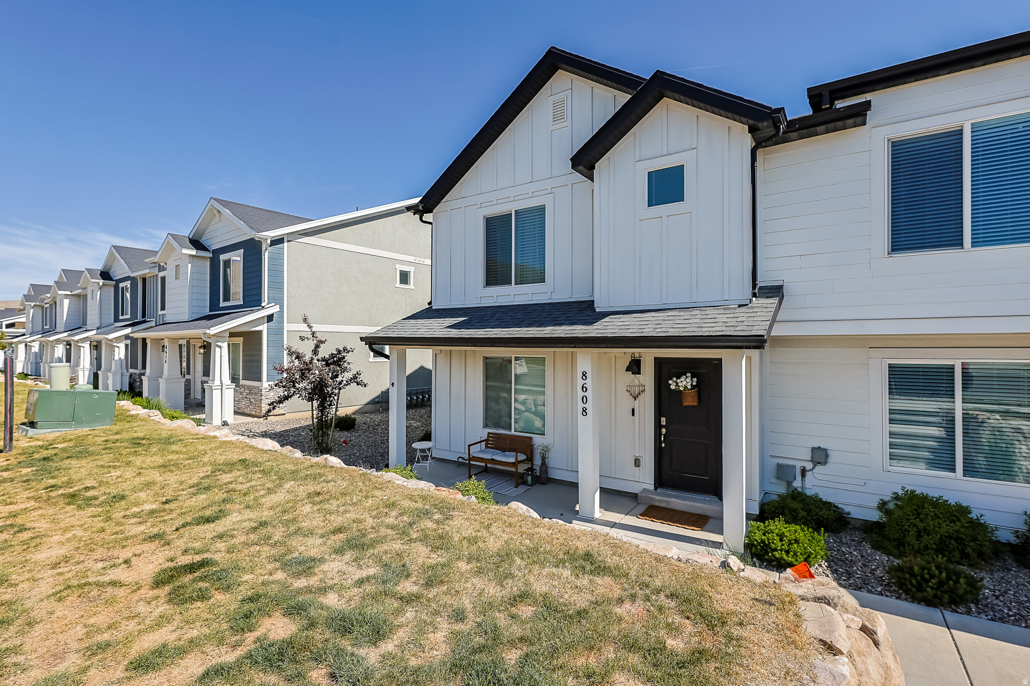 Welcome home to this darling farmhouse-style end-row townhome in the sought-after Little Gateway community in the heart of Magna! This like-new 3-bedroom, 2-bath beauty offers the perfect blend of charm, comfort, and low-maintenance living.  One of the standout features not highlighted in the listing is the large concrete crawl space complete with electrical ideal for extra storage.  Enjoy all the incredible community amenities Little Gateway has to offer, including a pool, basketball courts, pickleball courts, and a beautiful clubhouse. Conveniently located near shopping, dining, parks, and commuter access, this home truly has it all.