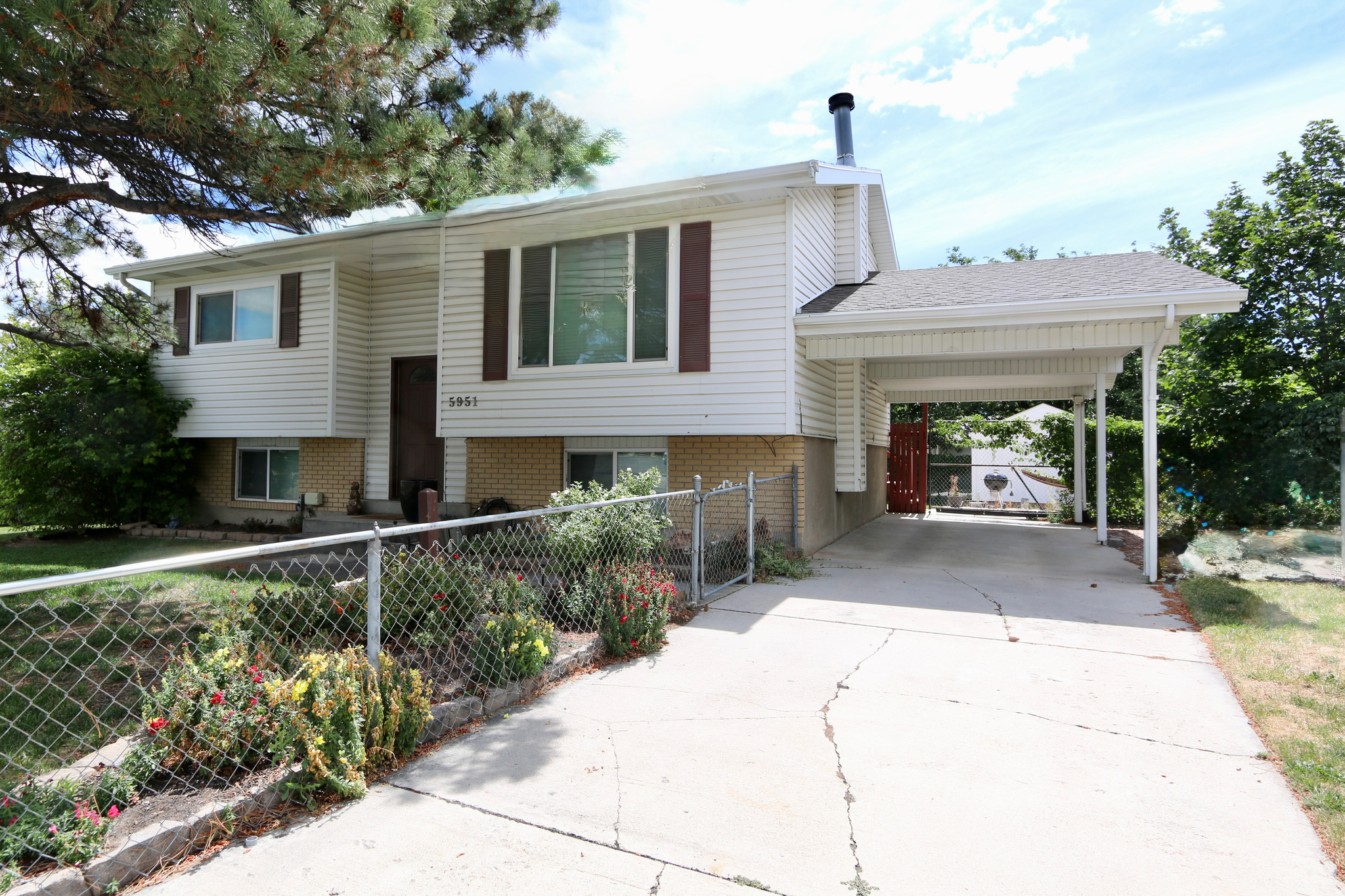 Beautiful light & open home on a spacious, private fenced yard in a nice neighborhood. Excellent condition with newer paint, vinyl windows & central air conditioner. The large kitchen has a French door that leads out to a deck & patio for relaxing & BBQs.  The lower level has its own entrance from the back patio/yard. A custom storage shed offers extra storage space.