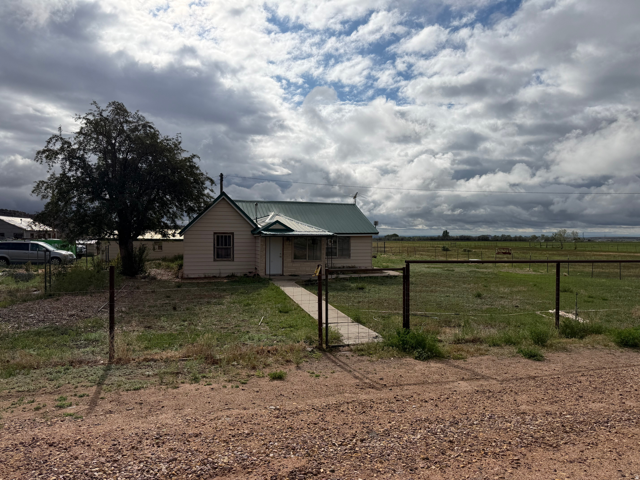 Fixer upper with 4.99 acres and 5 shares Lake Fork irrigation water. This property has 2 Parcel number's. 1st parcel comes with 2.65 acres & 2nd is 2.34 acres with a total of 4.99 acres.