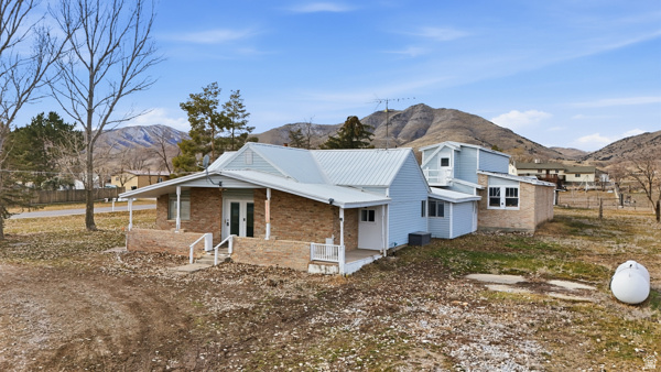 $5000 in closing costs if closed before June 30, and with full price. Enjoy peaceful rural living in this beautifully remodeled single-level home filled with charm, character, and opportunity. You can even bring your horses. Updated within the last few years, this move-in ready property features a spacious floor plan plus a bonus room (not included in the official square footage), offering flexibility for additional living space, hobbies, or a home office. Stay comfortable year-round with a newer furnace and enjoy the convenience of fiber optic internet for reliable remote work or streaming. Relax on the cozy screened-in patio or unwind on the inviting front porch-perfect for morning coffee and sunrises. The property also includes expansive shop and garage space, ideal for storage, projects, or business use. The possibilities are endless. Located just 35 minutes from Logan and approximately 20 minutes to Tremonton, this home offers the perfect balance of quiet country living with easy access to nearby amenities.