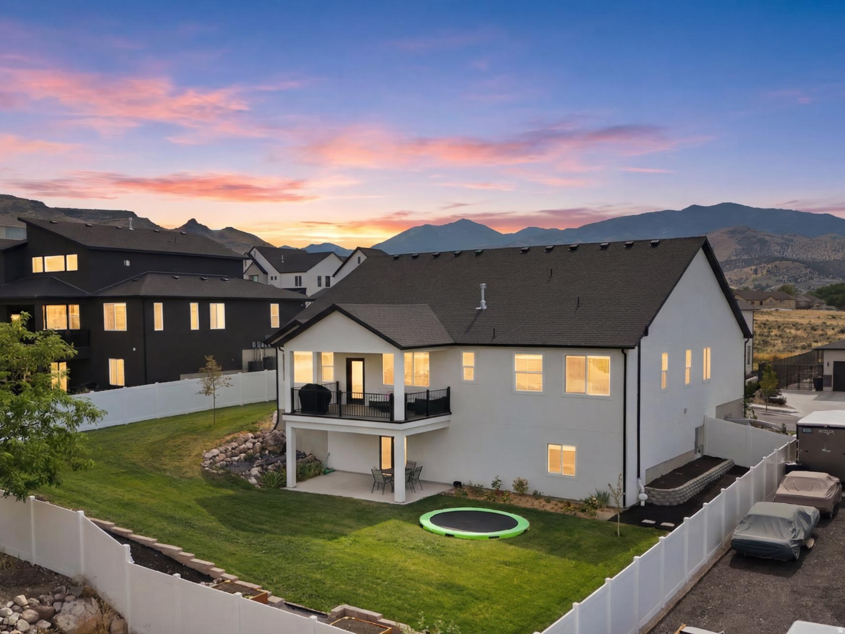 Properties of this caliber rarely hit the open market. Welcome to 14327 S Dennery Cove located breathtaking cul-de-sac in the highly desired Val Johnson subdivision. A true trophy estate in Herriman featuring an unparalleled, fully finished approximate 1,900 sq. ft. ADU walkout basement that generates premium income or provides elite multi-generational living. Bypassing the exhausting delays of new construction, this 2023-built, 4,818 sq. ft. architectural masterpiece sits on a premium cul-de-sac and is delivered fully finished and meticulously landscaped. If you have the opportunity to secure this residence, consider yourself among the fortunate few. Showcasing striking high-contrast exterior design, you are welcomed by an elegant foyer flanked by an enclosed, dedicated home office with beautiful french doors-perfect for remote work. The sun-drenched, open-concept main floor flows effortlessly, featuring soaring vaulted ceilings, a gourmet chef's kitchen with elite quartz countertops, double wall ovens, farmhouse sink, gas countertop range, large pantry, and stunning backsplash and finishes. This layout makes an excellent venue for entertaining. Enjoy the large living area, featuring a gas fireplace surrounded by herringbone tile to enhance the cozy Fall and Winer seasons Utah offers. During the warmer months step onto the expansive covered deck to experience premier indoor-outdoor living, perfectly framing panoramic mountain and valley views that offer breathtaking evening sunsets. The deck overlooks a fully fenced and beautifully landscaped, private backyard paradise equipped with a reinforced ground-level trampoline. The yard is boarded with beautiful garden beds and boxes that are connected to drop lines. Leading into the magnificent primary suite through french doors is a private sanctuary large enough for a seating lounge, flowing seamlessly into a resort-style bathroom with dual vanity sinks, a large soaking tub, sleek frameless shower, and a massive custom walk-in closet. Two additional bedrooms, a full bath, and half bath complete the main floor. The absolute crown jewel of this estate is the incredible full-daylight walkout basement. Flooded with an abundance of natural light and soaring 10' ceilings this lower level completely defies the standard basement feel, truly living like its own independent home. It walks out directly to a private covered patio and the beautifully landscaped backyard. This dual-purpose powerhouse features a large wellness room complete with a private sauna that can be accessed from both those residing on the main floor or the accessory dwelling. Occupying the other wing is the independent ADU featuring two spacious bedrooms, a 3/4 bath finished with a beautifully custom tiled walk in shower, a second full kitchen, and its own private laundry room (washer and dryer included) and water heater. It stands as the ultimate asset for generating substantial rental income to effortlessly offset your mortgage. Beyond the impeccable property boundaries with its 3-car extra-deep and extra-wide garage and absolutely NO HOA fees, this home unlocks an elite Herriman lifestyle. For the outdoor enthusiast, this location is a dream! Offering unprecedented access to world-class recreation. You are mere minutes from W & M Butterfield Park, Cove Pond, Wide Hollow Trailhead (AKA The Stairs), Butterfield Trailhead Regional Park, Blackridge Reservoir, where you can spend your weekends relaxing on the sandy beaches, paddleboarding, or exploring the expanding Bonneville Shoreline Trail. You are perfectly positioned for endless entertainment and conveniences. Turn-key estates with this level of finish, income potential, and lifestyle access simply do not exist anywhere else. Do not miss your singular opportunity to claim Herriman's premier listing. Schedule your private showing today.  Square footage figures are provided as a courtesy estimate only and were obtained from the county records. Buyer and buyer agent is a