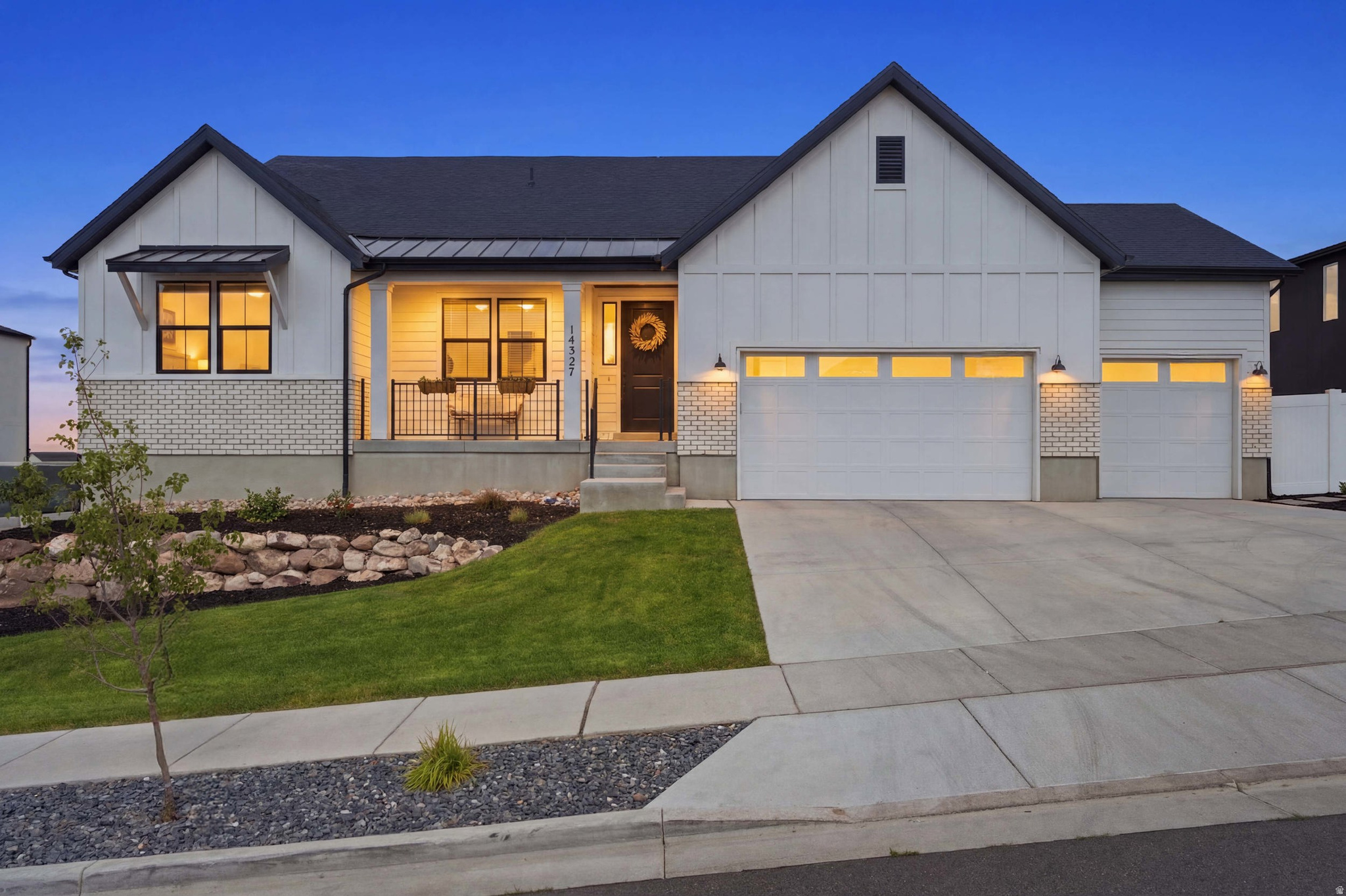 Properties of this caliber rarely hit the open market. Welcome to 14327 S Dennery Cove located breathtaking cul-de-sac in the highly desired Val Johnson subdivision. With the mountainside at your doorstep, this true trophy estate in Herriman featuring an unparalleled, fully finished aprx 1,900 sq. ft. ADU walkout basement that generates premium income or provides elite multi-generational living. Bypassing the exhausting delays of new construction, this 2023-built, 4,818 sq. ft. architectural masterpiece sits on a premium cul-de-sac and is delivered fully finished and meticulously landscaped. If you have the opportunity to secure this residence, consider yourself among the fortunate few. Showcasing striking high-contrast exterior design, you are welcomed by an elegant foyer flanked by an enclosed, dedicated home office with beautiful french doors-perfect for remote work. The sun-drenched, open-concept main floor flows effortlessly, featuring soaring vaulted ceilings, a gourmet chef's kitchen with elite quartz countertops, double wall ovens, farmhouse sink, gas countertop range, large pantry, and stunning backsplash and finishes. Enjoy the large living area, featuring a gas fireplace surrounded by herringbone tile. Step onto the expansive covered deck to experience premier indoor-outdoor living, perfectly framing panoramic mountain and valley views that offer breathtaking evening sunsets. The deck overlooks a fully fenced and beautifully landscaped, private backyard paradise equipped with a reinforced ground-level trampoline. The yard is boarded with beautiful garden beds and boxes that are connected to drop lines. Leading into the magnificent primary suite through french doors is a private sanctuary large enough for a seating lounge, tray ceiling, flowing seamlessly into a resort-style bathroom with dual vanity sinks, a large soaking tub, sleek frameless shower, and a massive custom walk-in closet. Two additional bedrooms, a full bath, and half bath complete the main floor. The absolute crown jewel of this estate is the incredible custom finished full-daylight walkout basement. Flooded with an abundance of natural light and soaring 10' ceilings this lower level completely defies the standard basement feel, truly living like its own independent home. It walks out directly to a private covered patio and the beautifully landscaped backyard. This dual-purpose powerhouse features a large wellness room complete with a private sauna that can be accessed from both those residing on the main floor or the accessory dwelling. Occupying the other wing is the independent ADU featuring two spacious bedrooms, a 3/4 bath finished with a beautifully custom tiled walk in shower, a second full kitchen, and its own private laundry room (washer and dryer included) and water heater. It stands as the ultimate asset for generating substantial rental income to effortlessly offset your mortgage. Beyond the impeccable property boundaries with its 3-car extra-deep and extra-wide garage and absolutely NO HOA fees, this home unlocks an elite Herriman lifestyle. For the outdoor enthusiast, this location is a dream! Offering unprecedented access to world-class recreation. You are mere minutes from W & M Butterfield Park, Cove Pond, Wide Hollow Trailhead (AKA The Stairs), Butterfield Trailhead Regional Park, Blackridge Reservoir, where you can spend your weekends relaxing on the sandy beaches, paddleboarding, or exploring the expanding Bonneville Shoreline Trail. You are perfectly positioned for endless entertainment and conveniences. Turn-key estates with this level of finish, income potential, and lifestyle access simply do not exist anywhere else. Do not miss your singular opportunity to claim Herriman's premier listing. Schedule your private showing today.  Square footage figures are provided as a courtesy estimate only and were obtained from the county records. Buyer and buyer agent is advised to verify all.