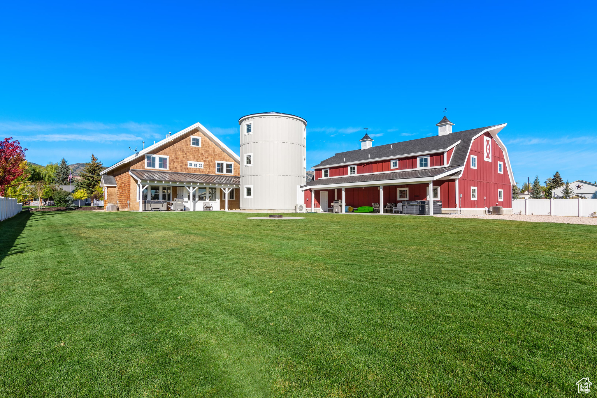 We've recently adjusted the price to make this home an even better value-come take a look! Incredible Short-Term Rental Opportunity in the Heart of Garden City! Sits on 1 acre, this unique property features a Farmhouse, Barnhouse, and Silo, each thoughtfully designed to attract guests and ensure repeat bookings. Sold together, these two expansive homes offer a combined 8,945 sq ft of living space, including 10 bedrooms, 9 bathrooms, and two oversized great rooms with spacious kitchens and dining areas-perfect for large groups. With four dedicated laundry areas, this property is both convenient and impressive.  Accommodating up to 80 guests or offering the option to rent the homes separately, this property is ideal for both small and large gatherings. Enjoy the outdoors with ample space, including two patios, two hot tubs, a fire pit, a 23x26 shop, and a 6-car shed. There's plenty of parking, including space for boats and toy trailers.  Fully self-managed, this turnkey investment includes established VRBO, Airbnb, and Google Business accounts with 5-star ratings, integrated marketing, booking, and management software (https://bearlakesilo.com/), and all in place to streamline operations. The sale also includes all furniture, furnishings, linens, a fully equipped kitchen setup, and a complete Smart Home system for remote management.  With existing bookings already generating income, this property is ready to go. Don't miss out, contact your Realtor to schedule a showing today!