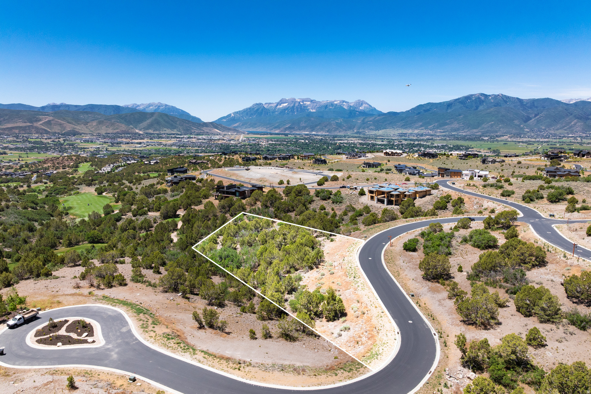 Homesite 640 offers a rare opportunity to own one of Red Ledges' premier homesites. Nestled on a quiet cul-de-sac within the private gates of the community, this exceptional 1.56-acre property captures sweeping views of Mt. Timpanogos, the Jack Nicklaus Signature Golf Course, and the southern Heber Valley. Its desirable south-facing orientation provides abundant natural light while minimizing western sun exposure, creating a more comfortable setting for year-round indoor and outdoor living.  The gentle downslope topography is ideally suited for a luxury mountain residence with a walkout lower level. Included in the purchase price are ARC-approved plans for a stunning 6,291-square-foot, 4-bedroom, 6-bath home designed by Highland Group Building Design, allowing the next owner to significantly accelerate the building process and begin construction with confidence.  Build the approved residence with Red Ledges Construction or another approved builder, create a fully custom home, or explore semi-custom opportunities through the Red Ledges Construction Artisan Program. A Red Ledges Golf Membership is available with deposit, providing access to championship golf, tennis, pickleball, fitness and wellness amenities, equestrian facilities, pools, and miles of trails within one of Utah's most sought-after private communities.