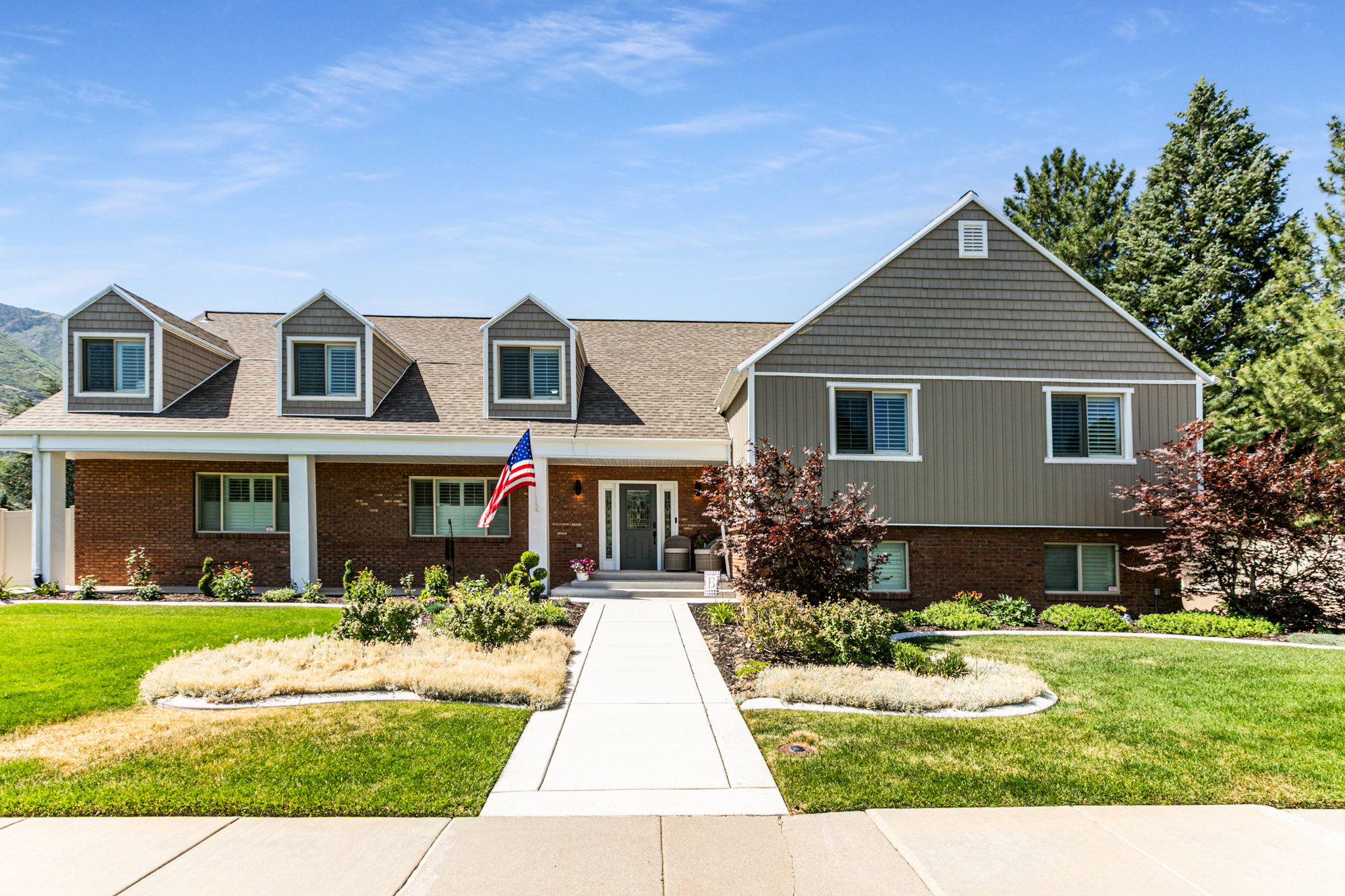 COME HOME to this beautiful 6-Bedroom, 6-Bathroom, and 4-Family room home located in east Sandy and the "you can almost touch the mountain" view!" This home offers a beautiful entry, large Formal Living & Dining Room; gorgeous kitchen showcasing beautiful cabinetry, granite counters, S/S appliances, oversized island, and gas range; all part of a Great Room which opens up from Kitchen to Dining and the spacious Family Room with updated Fireplace and a walk out to covered patio. Moving upstairs, you'll find a beautiful master suite, a walk-in closet, and master bathroom tiled in Travertine, 5 more bedrooms and a large family room with a fireplace.  Enjoy all the wonderful space the fully finished basement has to offer with a full kitchen, 2-spacious family rooms, theater room, and loads of storage. An ideal potential for a Mother-In-law apartment. Enjoy the peace and serenity this lovely property provides, with a covered back patio, spectacular view of the mountains, gorgeous landscaping, private lot, Swim-Spa, Sport Court with two basketball hoops, two large open patio areas for all your family and friend gatherings.  It's just minutes to Big & Little Cottonwood Canyons, hiking and biking trails, Dimple Dell equestrian park, shopping, schools, and Hidden Valley Country Club. A Must See!