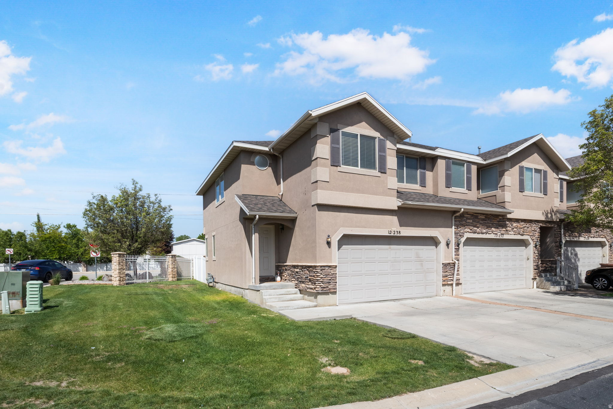 Hard to find end unit townhome with a private fenced backyard in a great Riverton location. This fully finished townhome offers 2,001 square feet with 3 bedrooms, 2 full bathrooms upstairs, a convenient half bath on the main level, and an additional half bath in the finished basement. The main floor features a bright, open layout with kitchen, dining, and family room spaces that feel comfortable and inviting, with extra natural light from the end unit setting. The finished basement adds valuable living space with a second family room, play area, and half bath, giving you flexibility for movie nights, hobbies, guests, or everyday living. One of the standout features is the private fenced backyard, a rare find for a townhome and a major plus for outdoor dining, pets, gardening, or simply having your own outdoor space. Located in a nice, smaller community with a clubhouse and park, this home is close to shopping, schools, dining, entertainment, and everyday conveniences. Minutes from I 15 and Bangerter Highway, the location makes commuting and getting around the Salt Lake Valley easy. A finished end unit townhome with this much space, light, and private outdoor living is one you will want to see.