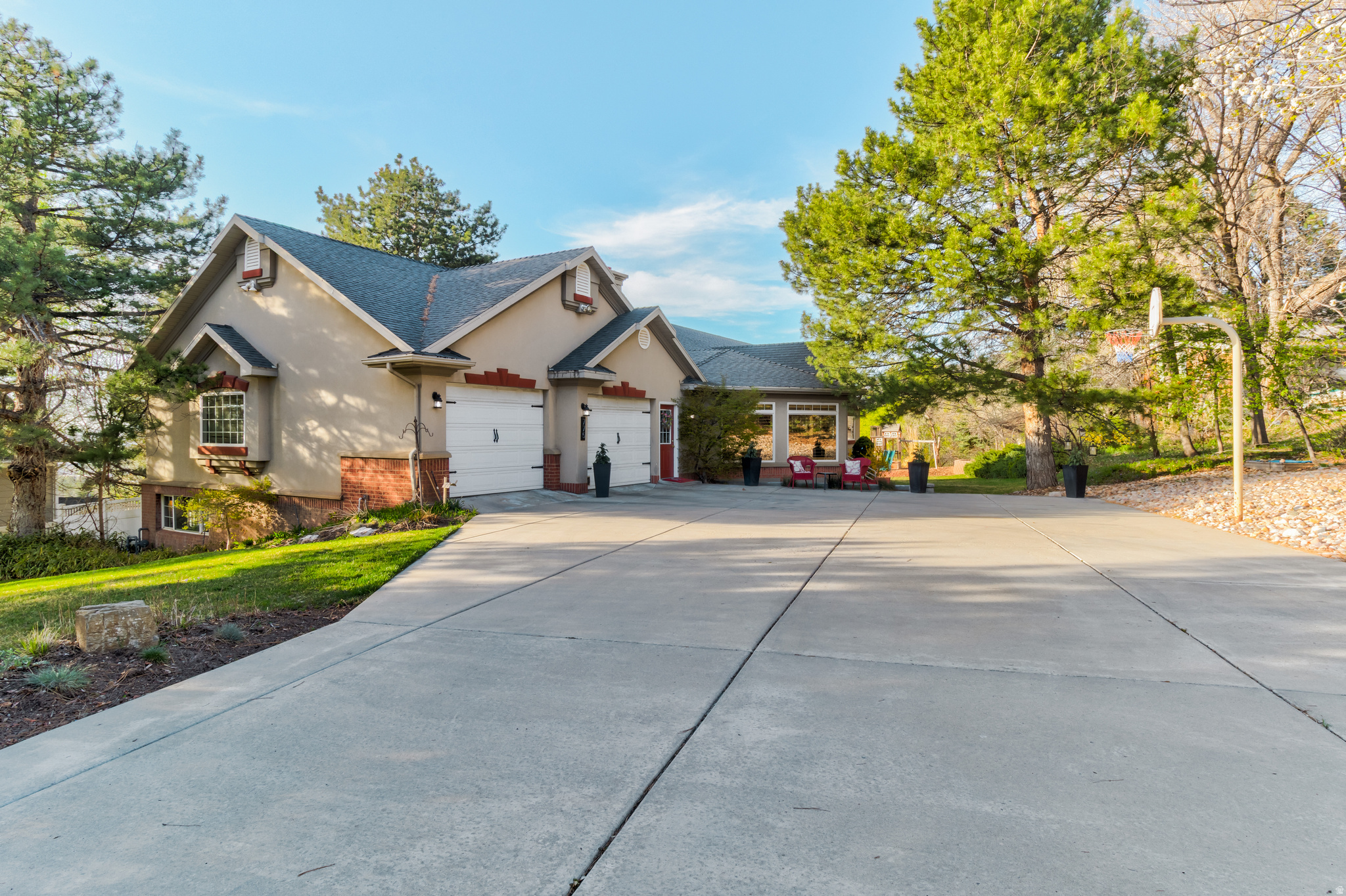 Welcome to a home designed for gathering, entertaining, and everyday comfort. Located on the desirable east bench of Bountiful... Step inside to an open and inviting living space that flows seamlessly into a spacious dining area-perfect for hosting everything from family dinners to larger gatherings. Just off the main living area, French doors lead to a dedicated office, offering a great work-from-home setup with privacy when you need it. The kitchen is built to impress, featuring a large center island, double ovens, a five-burner gas range, and abundant cabinet space-ideal for both daily living and entertaining. The main level includes a primary suite, a guest bedroom, and convenient access to a half bath off the garage. Upstairs, the guest bathroom offers a double vanity, making busy mornings easier. This home offers multiple living spaces and warmth throughout, with three fireplaces, including a cozy wood-burning stove in the expansive downstairs den. The fully finished walkout basement adds incredible flexibility with a second kitchen and separate living space, making it ideal for multi-generational living, long-term guests, or potential rental use. The lower level also includes an additional primary suite, two more bedrooms, and flexible space that could easily be used as a craft room, office, or hobby area. Step outside to a large, flat 0.40-acre lot with mature landscaping and room to relax, play, or entertain. The property also offers beautiful views of Utah Lake, creating a peaceful and scenic backdrop. A rare highlight of the home is the private indoor swimming pool, allowing for year-round enjoyment and a truly unique lifestyle feature. With multiple access points, generous storage throughout, and a versatile layout, this home offers a combination of space, function, and flexibility that is hard to find. Square footage figures are provided as a courtesy estimate only and were obtained from county records. Buyer is advised to obtain an independent measurement.