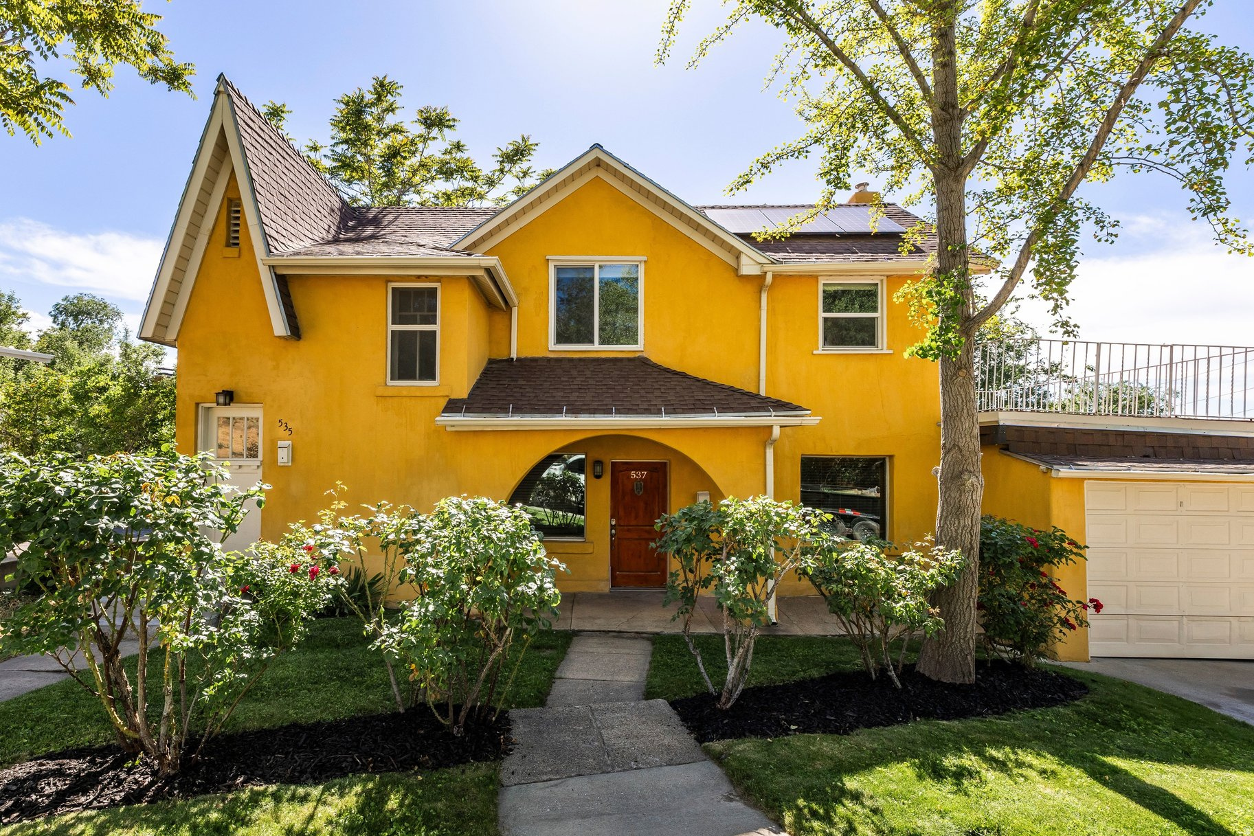 Rare opportunity to own a versatile duplex in Salt Lake City's vibrant Marmalade/Capitol Hill neighborhood, just minutes from downtown with easy access to nearby hiking and biking trails. With separate gas and electrical meters, this property offers flexibility for both investors and owner-occupants looking to offset expenses with rental income. Ideal setup for an owner-occupant to live comfortably in one unit while generating income from the other. The larger main-level unit features inviting living and dining spaces, 3 bedrooms, and 2.5 bathrooms. Two bedrooms and 1.5 baths are located on the main floor, while a spiral staircase leads to the lower level with an additional bedroom, full bath, laundry, and generous storage areas. Sliding glass doors open directly to the enclosed backyard and patio. The upstairs unit was recently renovated and enjoys valley views from a private deck. Major system upgrades include a 3.15kW solar system, central ducted mini-split heating and cooling upstairs, newer central HVAC downstairs, updated electrical, separate water heaters, and upgraded windows throughout much of the property. Attached one-car garage. Photographs included in the listing contain virtually staging of furniture and otherdecorand are intended forillustrative purposes only.