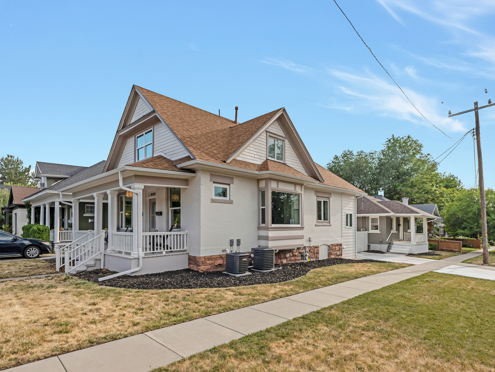 Two fully renovated homes, one incredible 9th & 9th address. Set on a flat corner lot in the Belmont neighborhood, this rare offering pairs a beautifully restored 1907 Victorian with a detached 2 bed / 1 bath accessory home - each with its own entrance and separate gas and electric meters. The main house delivers 3 beds and 2 baths across light-filled living spaces, anchored by a remodeled galley kitchen with gas range and a private upstairs primary suite featuring a marble walk-in shower, dual vanities, and a walk-in closet. Vaulted ceilings, marble countertops, LVP flooring, smart thermostats, and an updated main-floor full bath round out the interior. Out back, 938 E Herbert Ave. offers a full kitchen and flexible living space - ideal for rental income, multigenerational living, guests, or a dedicated home office. Multi-family zoning and the walkable 9th & 9th location - minutes to the University of Utah, Westminster, Sugar House, and downtown - make this a standout for owner-occupants and investors alike.