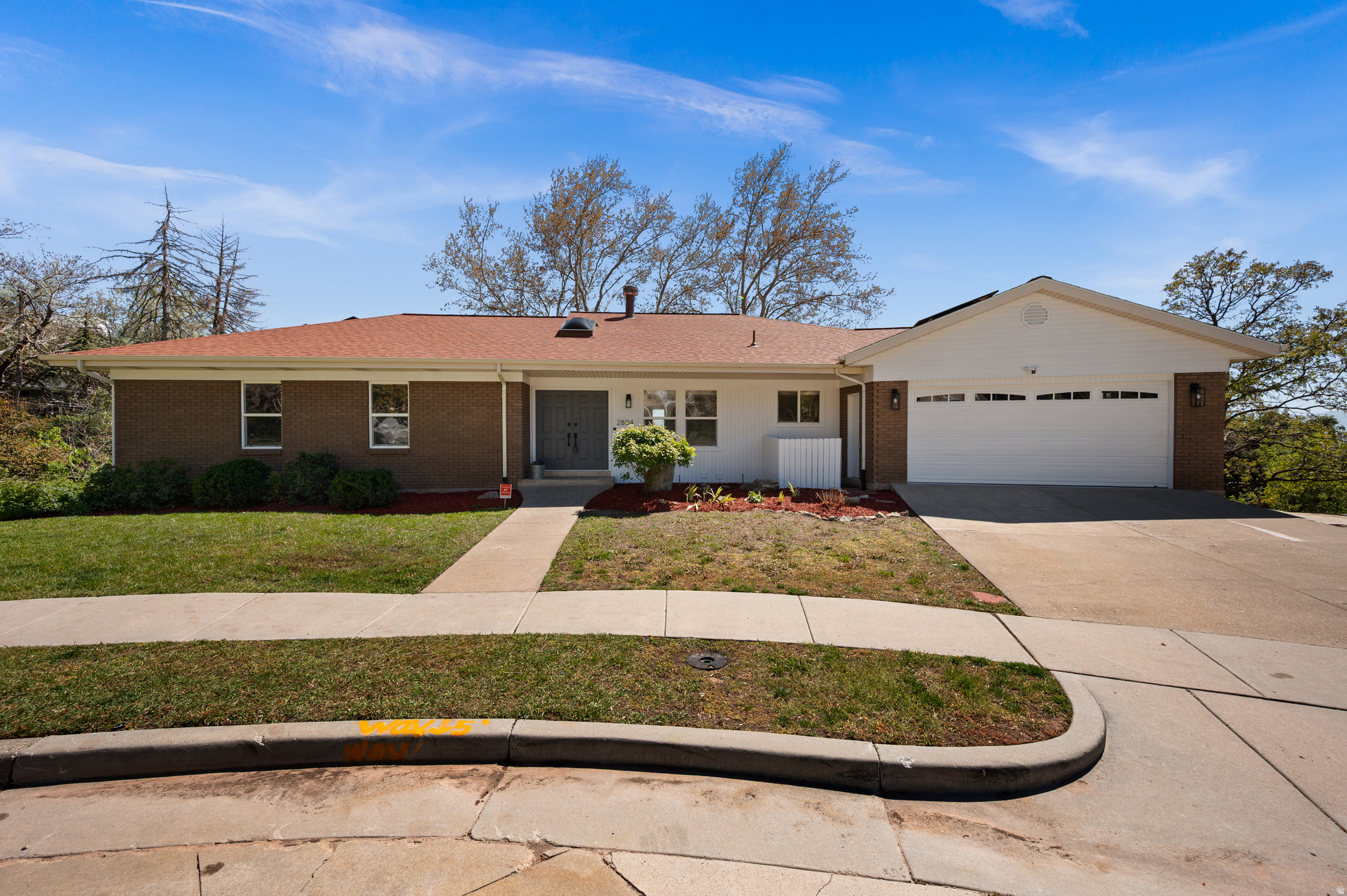 Located on a charming cul-de-sac in the coveted Arcadia Heights, this property sits on a rare oversized 0.36-acre lot with breathtaking, unobstructed views of Mt. Olympus, Oquirrh Mountains and the Salt Lake Valley. Flooded with natural light, the home features floor-to-ceiling south-facing windows that seamlessly bring the outdoors in. Expansive decks off both levels create indoor-outdoor living, perfect for soaking in the scenery or entertaining. The backyard, beautifully framed by two mature sycamore trees, offers endless potential- whether you envision a serene retreat or a vibrant gathering space. The main level offers a large living room/dining area, spacious kitchen, a primary suite with a private deck and an office featuring custom cabinetry-easily convertible to an additional bedroom. The lower level boasts a generous bonus room ideal for a home gym, media space, or entertainment area, as well as a family room, two additional bedrooms and a full bathroom. A versatile secondary kitchen or bar area adds flexibility for hosting or multi-generational living. Additional highlights include: new roof (2021), solar panels, Tesla charging station, just a few minutes to freeway access, about 10-15 minutes to the University of Utah and SLC International Airport and steps away to the Shoreline Trails. This house is a truly special opportunity in one of Salt Lake City's most beloved neighborhoods.