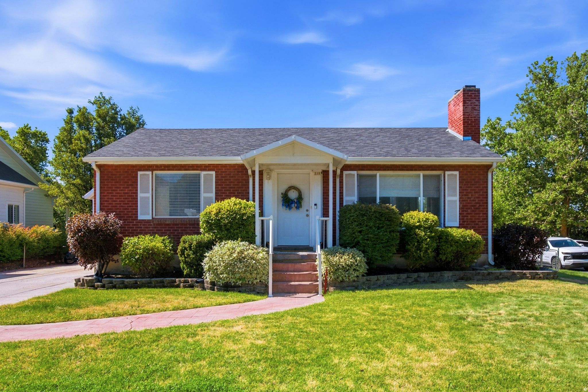 Welcome home to this charming red brick rambler nestled on a spacious corner lot in the heart of Centerville. Built in 1951, this well-maintained home blends timeless character with thoughtful updates, including an updated kitchen, beautiful hardwood floors, and a tankless water heater. Original built-in storage adds to the home's vintage appeal, while two covered porches and an open patio provide inviting spaces to relax and enjoy the outdoors.  Situated on a fully fenced quarter-acre lot, the property features mature fruit trees, fruit bushes, and plenty of space for gardening, play, or entertaining. Inside, you'll find 3 bedrooms, 2 full bathrooms, and a large basement family room with potential to create a 4th bedroom if desired.  One of the standout features of this property is the oversized detached 2-car garage. Designed for hobbyists, mechanics, woodworkers, or anyone needing exceptional workspace, the garage includes built-in storage, water service, a wood-burning stove, extra-wide bay, and a massive loft with exciting potential for future conversion into an ADU, guest quarters, studio, or additional living space (buyer to verify). A long driveway provides ample off-street parking, including RV parking with electrical hookups.  This is a rare opportunity to own a property that offers character, functionality, and future possibilities all in one.   Square footage figures are provided as a courtesy estimate only and were obtained from county records. Buyer is advised to obtain an independent measurement.