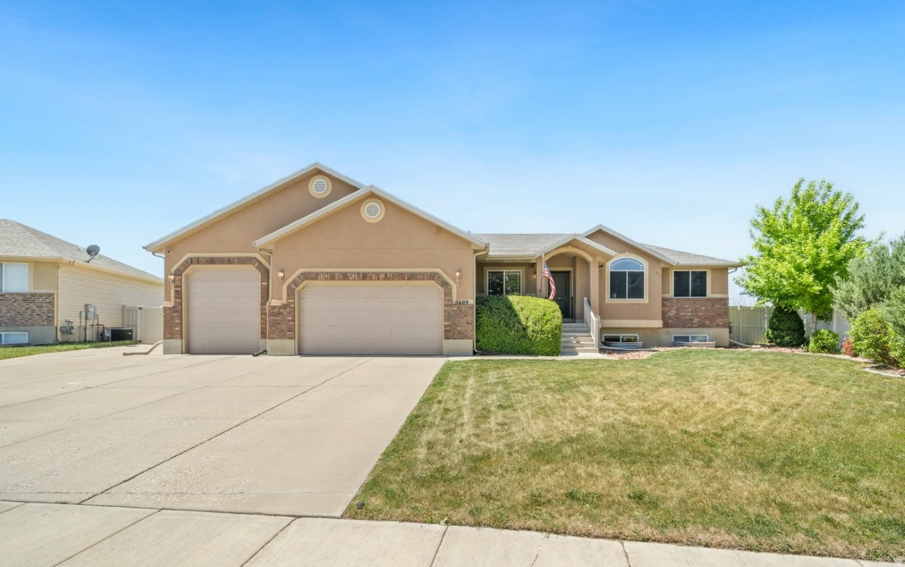 Beautiful home on a 1/3-acre lot with stunning mountain views, vaulted ceilings, granite countertops, updated flooring, and plenty of natural light throughout. This spacious 7-bedroom, 2.75-bath home features a fully finished basement, covered back patio, inviting front porch, and a fully fenced backyard with mature trees. Additional highlights include an extra-deep garage with extra height, a 240 electrical outlet in the garage, RV parking pad, backyard shed, and established landscaping. The primary bathroom has been beautifully updated with a dual shower, heated floors, and temperature control. Conveniently located near local schools, parks, and neighborhood amenities.
