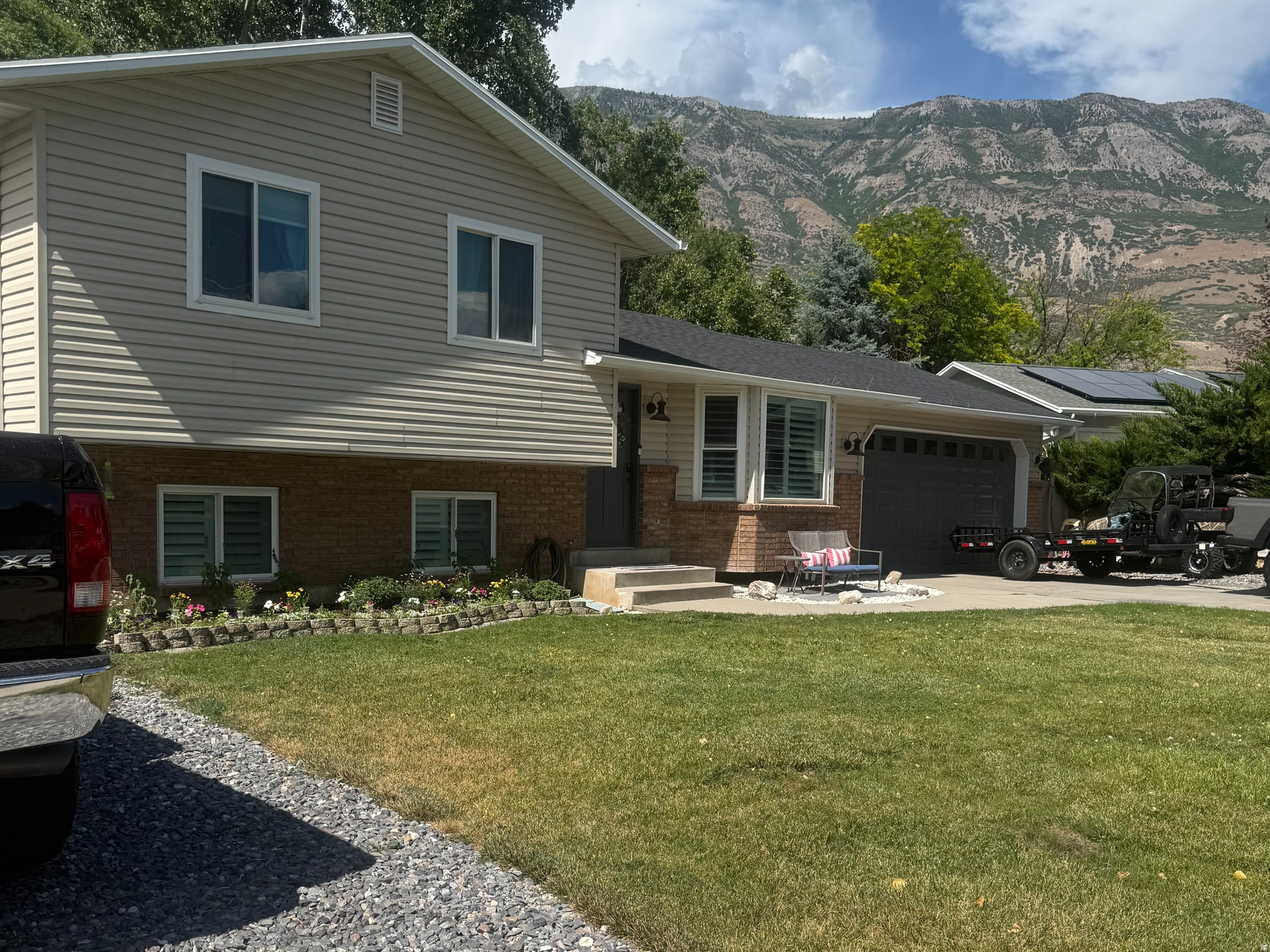 Beautifully updated home with breathtaking mountain views! Pride of ownership shines throughout this exceptionally clean, well-maintained home. Featuring tasteful updates, this is the perfect place to raise a family. Situated on a large lot with a chicken coop, RV parking, there's plenty of room for vehicles, toys, and outdoor living. Don't miss the opportunity to own this move-in-ready home in a fantastic setting! Square footage is provided per county records; buyer is advised to verify all information. Roof, siding, windows, heating & air and water softener all updated 2022.