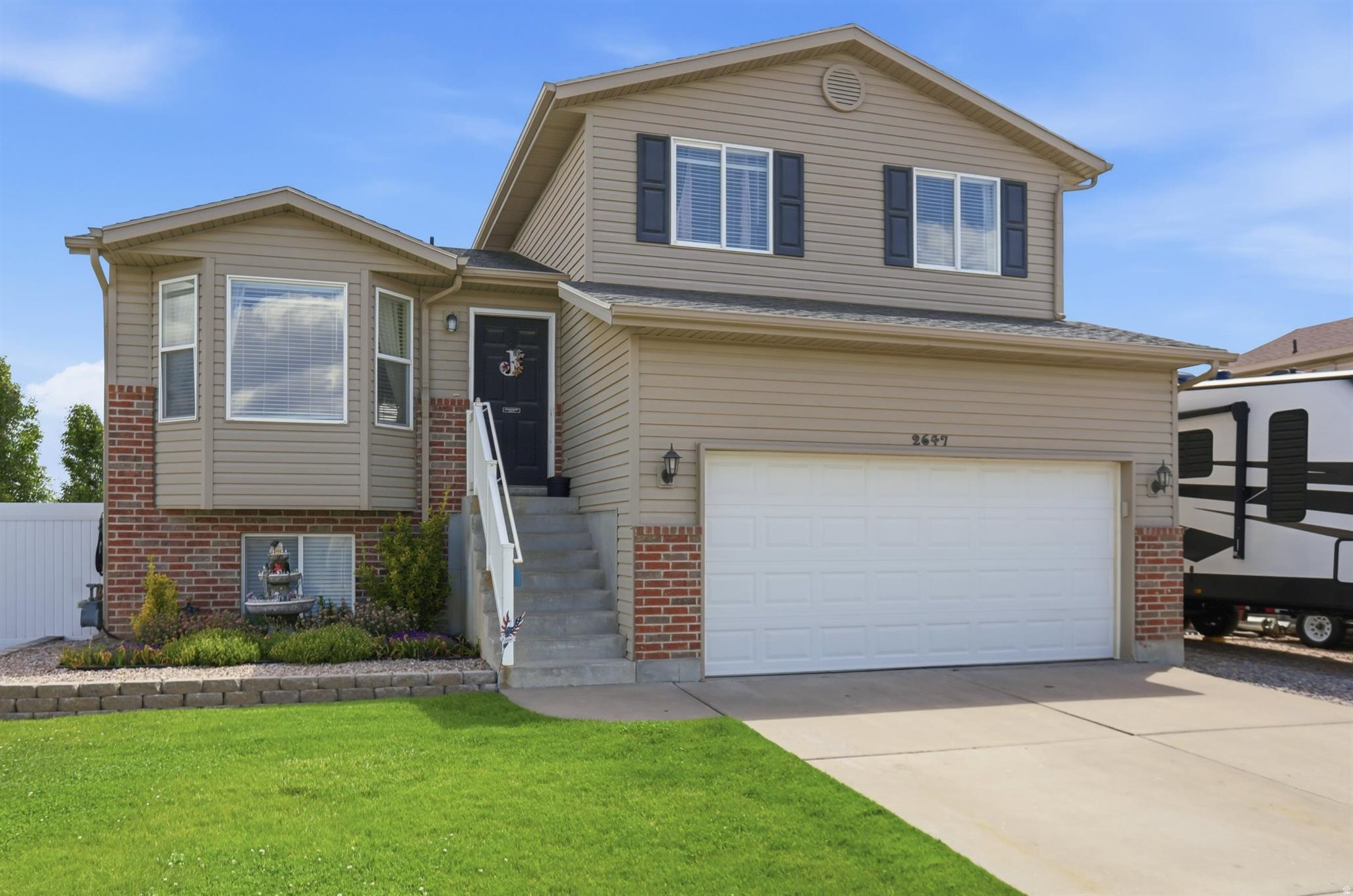Beautifully positioned on a desirable corner lot, this spacious multi-level home offers the perfect blend of comfort, functionality, and outdoor living. Featuring 4 bedrooms and 3 bathrooms, new carpet, this home provides plenty of room for family, guests, and entertaining. The spacious kitchen is designed for gathering, complete with a convenient snack bar, abundant cabinetry, and an adjoining dining area perfect for everyday dining. The large family room creates a warm, inviting atmosphere with a walkout door leading to a backyard retreat. Step outside and enjoy the covered deck overlooking the fully fenced yard, ideal for relaxing. The backyard also features a garden area, an 8 x 10 storage shed, and an on the side of the home an impressive 30 x 70 gravel RV pad offering  space for RV parking, trailers, toys, or additional storage needs. This home offers everything needed for comfortable living both inside and out.