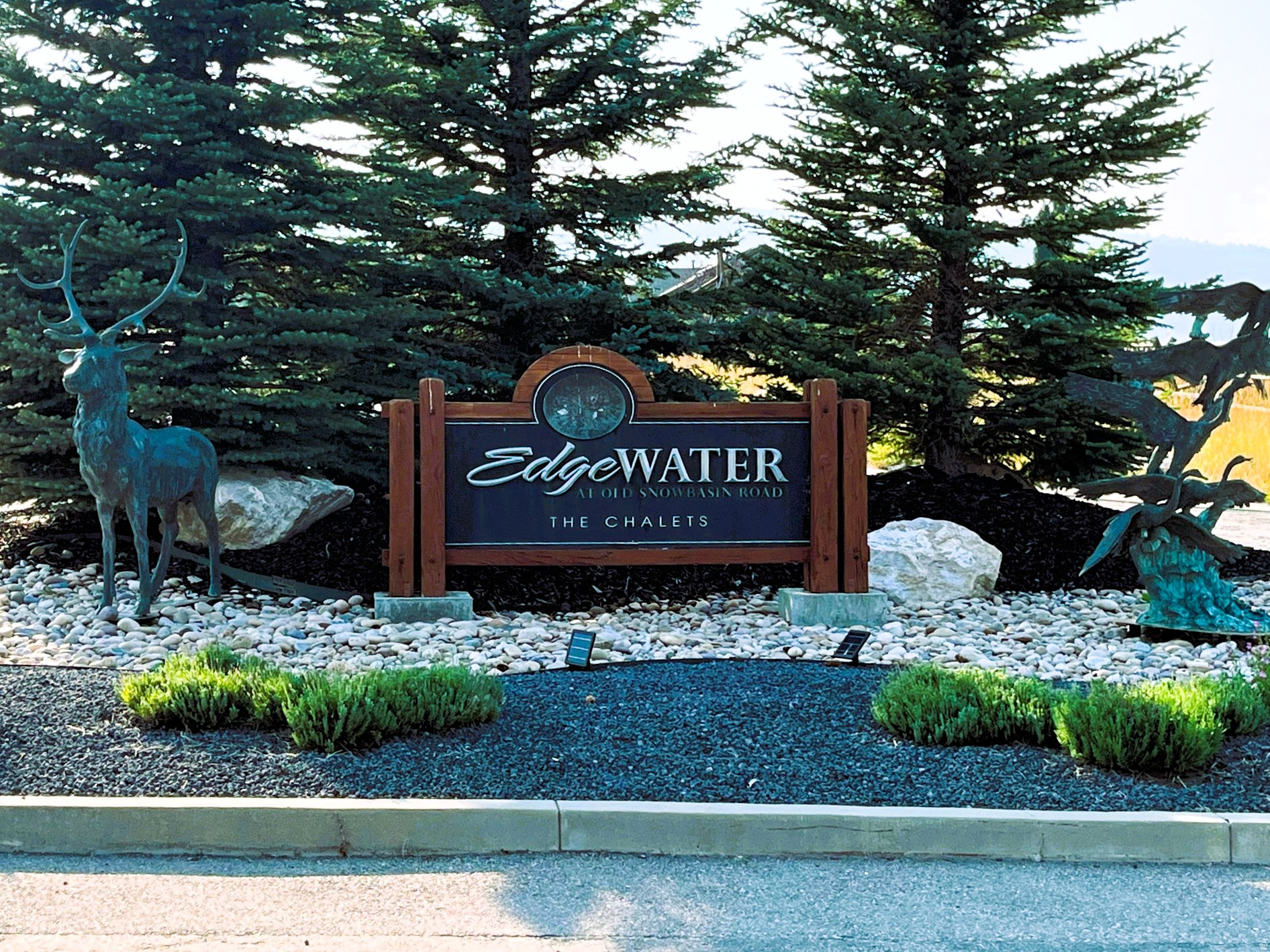 Set within the carefully planned Edgewater Chalets subdivision, this exceptional homesite offers the perfect blend of mountain adventure and lakeside living in the heart of Huntsville, Utah. Located in a fantastic development that is ideally situated at the base of Old Snowbasin Road and Highway 39, you're just minutes from world-class skiing at Snowbasin Resort and a short 25-minute drive to Powder Mountain, while an extensive network of hiking and biking trails begins just minutes from your door.  You will have a beautiful view directly across the street of Pineview Reservoir. The reservoir offers boating, paddleboarding, swimming, and endless water recreation, making this location a true four-season playground. Known for its elevated lake and mountain views, Edgewater Chalets is a community with a dedicated Architectural Control Committee that preserves view corridors and ensures cohesive, high-quality design throughout the neighborhood. This is the perfect opportunity to design your dream retreat, just 15 minutes from Ogden for shopping, dining, and amenities. Boundary lines are provided as a courtesy estimate only; buyer is advised to obtain an independent measurement.  Square footage figures are provided as a courtesy estimate only and were obtained from County records.  Buyer is advised to obtain an independent measurement.