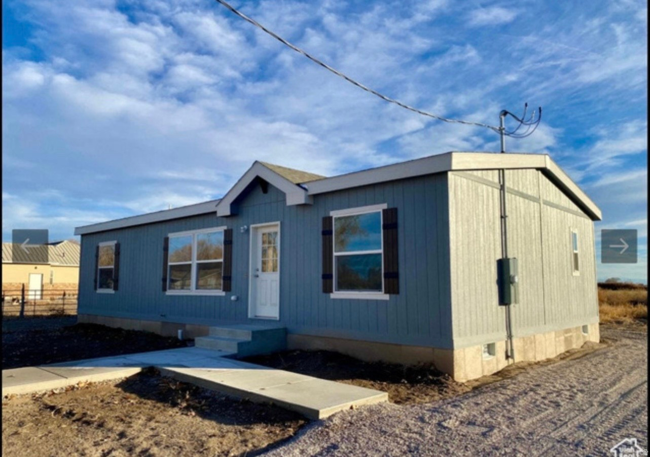 Like new, 2023, one-owner 3-bedroom, 2-bath manufactured home on a huge lot.  Almost 1/2 acre.  Partially fenced in the back yard with unobstructed views. Located across from the Hinckley Rodeo Arena & Park.