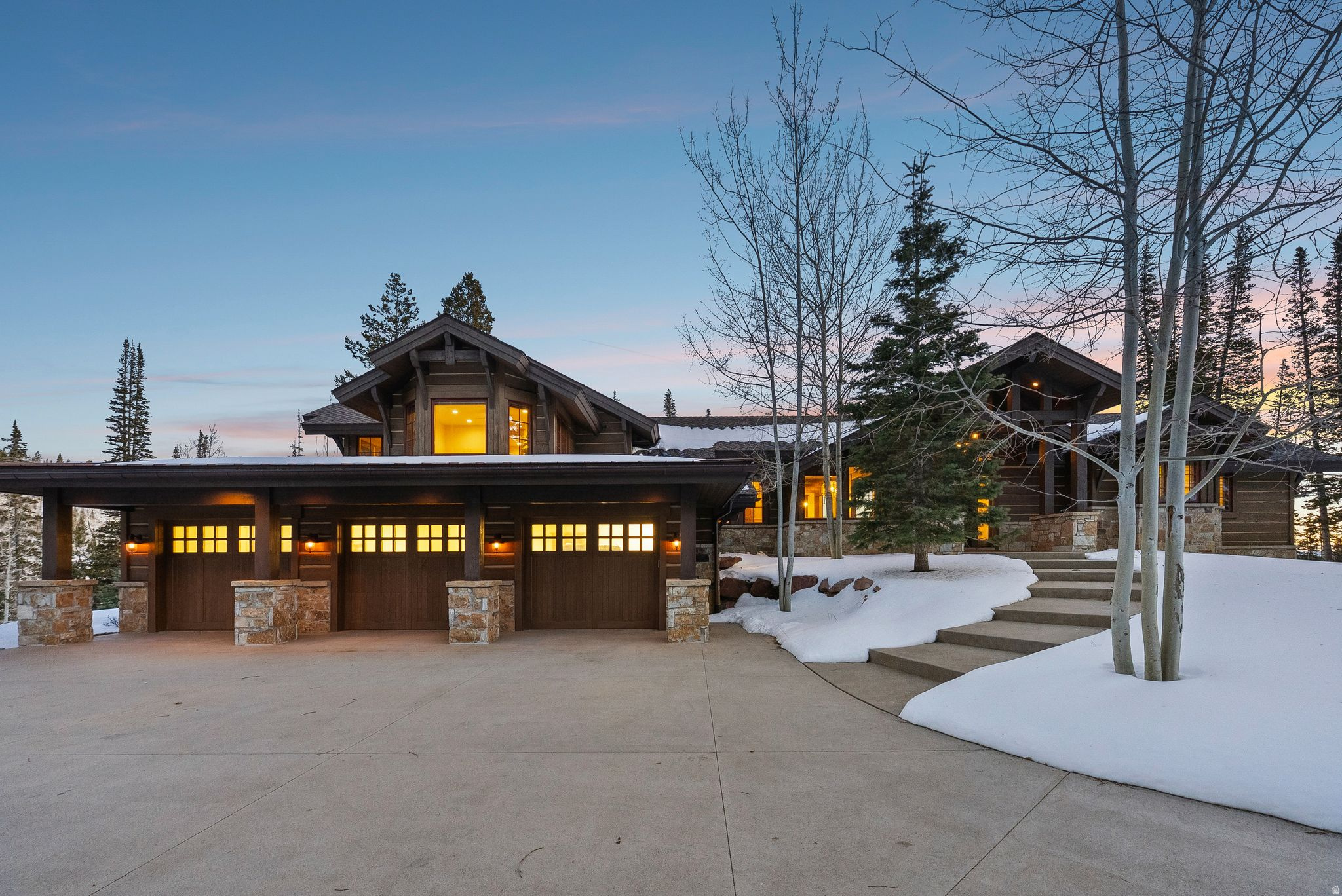 Welcome to 137 White Pine Canyon, an exceptional mountain retreat where timeless architecture, elevated craftsmanship, and effortless luxury converge. Set on 5.26 private, wooded acres within The Colony at White Pine Canyon, this 7,609 sq ft estate is designed to harmonize with its surroundings while offering every modern comfort and convenience. From the moment you enter, the home reveals its commitment to quality and authenticity. Rich hardwood flooring, vaulted ceilings, and solid stain-grade wood doors create a warm and enduring foundation. Every detail-from the custom stain-grade casings to the hand-selected lighting and plumbing fixtures-reflects thoughtful design and impeccable taste. The heart of the home is its stunning chef's kitchen, appointed with Wolf and Sub-Zero appliances, custom cabinetry, and beautifully crafted finishes. This space opens seamlessly to the hearth room, where one of the home's six fireplaces adds a welcoming mountain ambiance. Multiple gathering spaces, including a spacious lower-level family room, ensure comfort and connection for family and guests alike. With 67 bedrooms and 7 full bathrooms plus a powder room, the home accommodates both quiet retreats and lively gatherings. A standout feature is the custom-built bunk room-carefully designed for comfort and year-round fun. Everyday life is made smoother with a dedicated ski room, mud room, a generous three-car garage, and intelligent home systems. The property is equipped with integrated audio, radiant heat flooring, central air conditioning, and heated decks, patios, and driveway-ensuring effortless living in all seasons. Expansive windows and thoughtfully placed outdoor living spaces frame exceptional mountain views, while mature landscaping enhances privacy and natural beauty year-round. Whether gathering around the fire after a day on the slopes or enjoying a quiet summer evening on a heated patio, the home invites connection to the landscape in every season. Beautifully crafted. Intelligently designed. Impossibly comfortable.137 White Pine Canyon is a mountain sanctuary like no other.