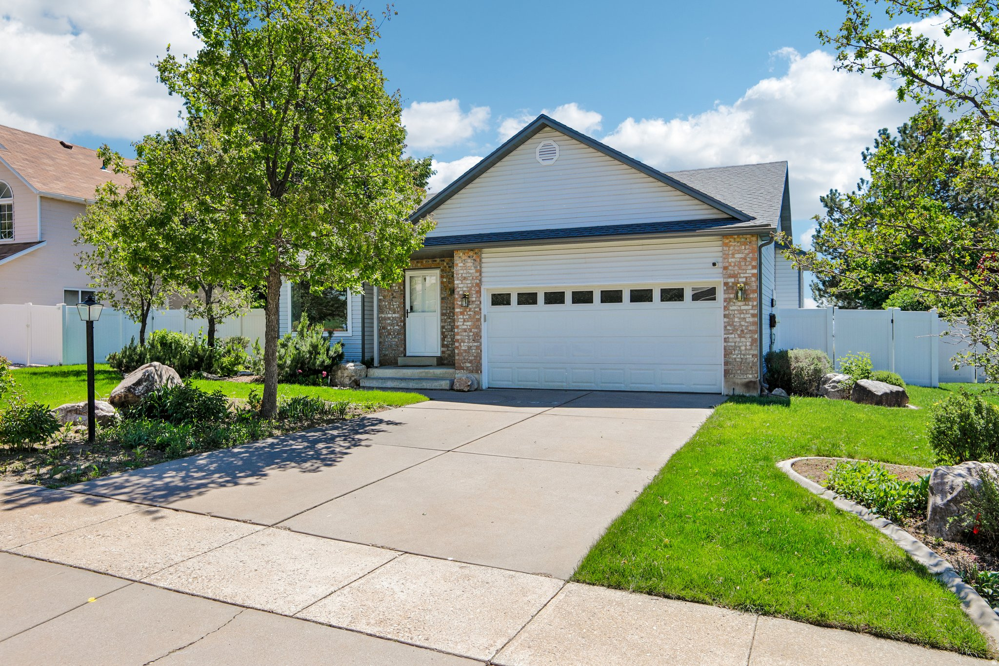 Incredible, breathtaking views set the stage for this beautifully maintained home in a quiet North Ogden neighborhood! This inviting property features a walk-out basement and an impressive list of updates, including new triple-pane windows (2025), new carpet (2023), and a furnace that has been diligently serviced every spring and fall, with quarterly filter replacements. Enjoy added peace of mind with major improvements such as a radon mitigation system (2024), new water heater (2024), and gutters replaced in 2025. The home also features a new front door and security door upstairs (2024), along with an additional security door for the walk-out basement, providing both comfort and security. The kitchen is truly move-in ready, complete with a refrigerator, range, and microwave, all of which are included. Step outside to a newer fence (2023) and enjoy access to a well-maintained community offering HOA amenities such as internet and cable, walking paths, parks, a basketball court, pickleball area, playground, and a nearby nature park. Perfectly situated in a peaceful setting with no overhead flight path disturbance from HAFB, yet just minutes from shopping and everyday conveniences, this home offers an ideal balance of tranquility and accessibility. Don't miss the opportunity to own a home that combines stunning views, thoughtful updates, and exceptional livability. Schedule your tour today-showings are easy and flexible!